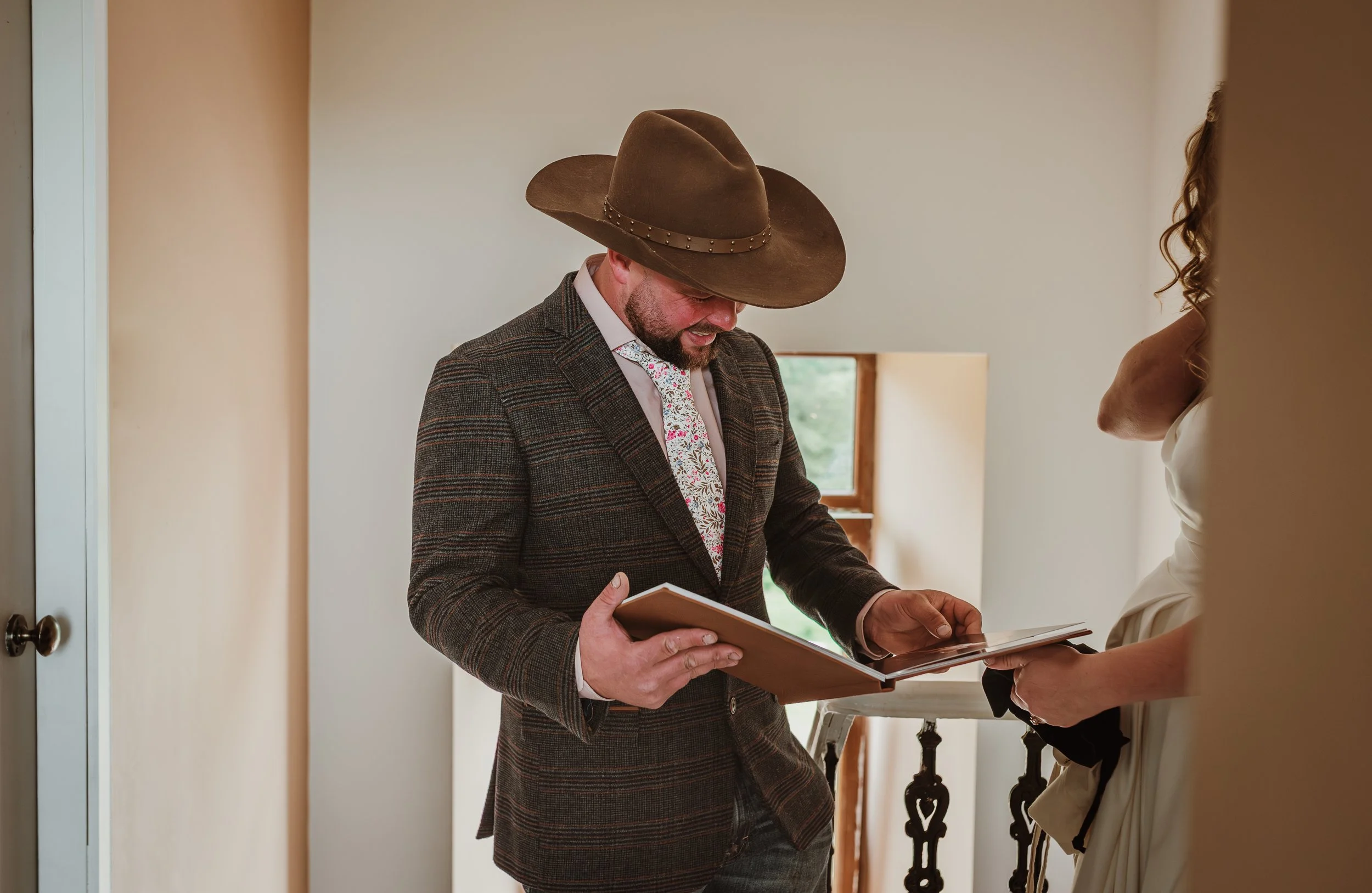 Husband receiving a wedding boudoir photography gift from his bride at Marieke Captures studio in Glasgow, Scotland — a heartfelt and unforgettable wedding day surprise