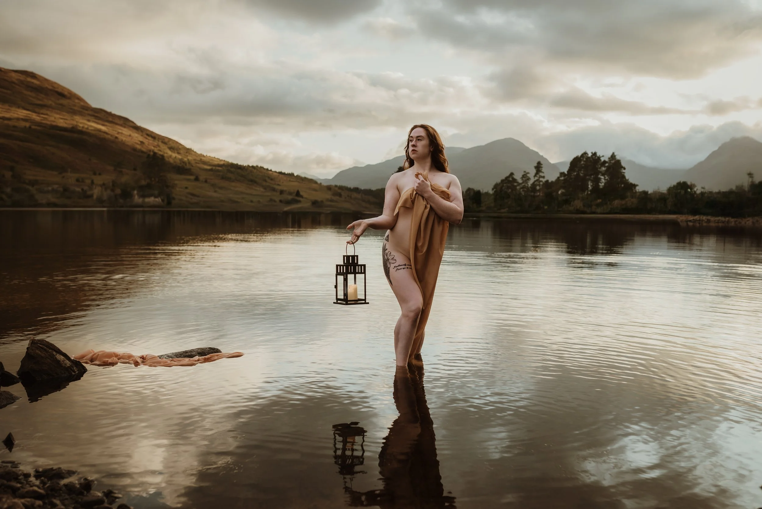Woman standing in a Scottish Highland loch during an adventure boudoir photography session with Marieke Captures — outdoor boudoir photography in Scotland's wild landscape