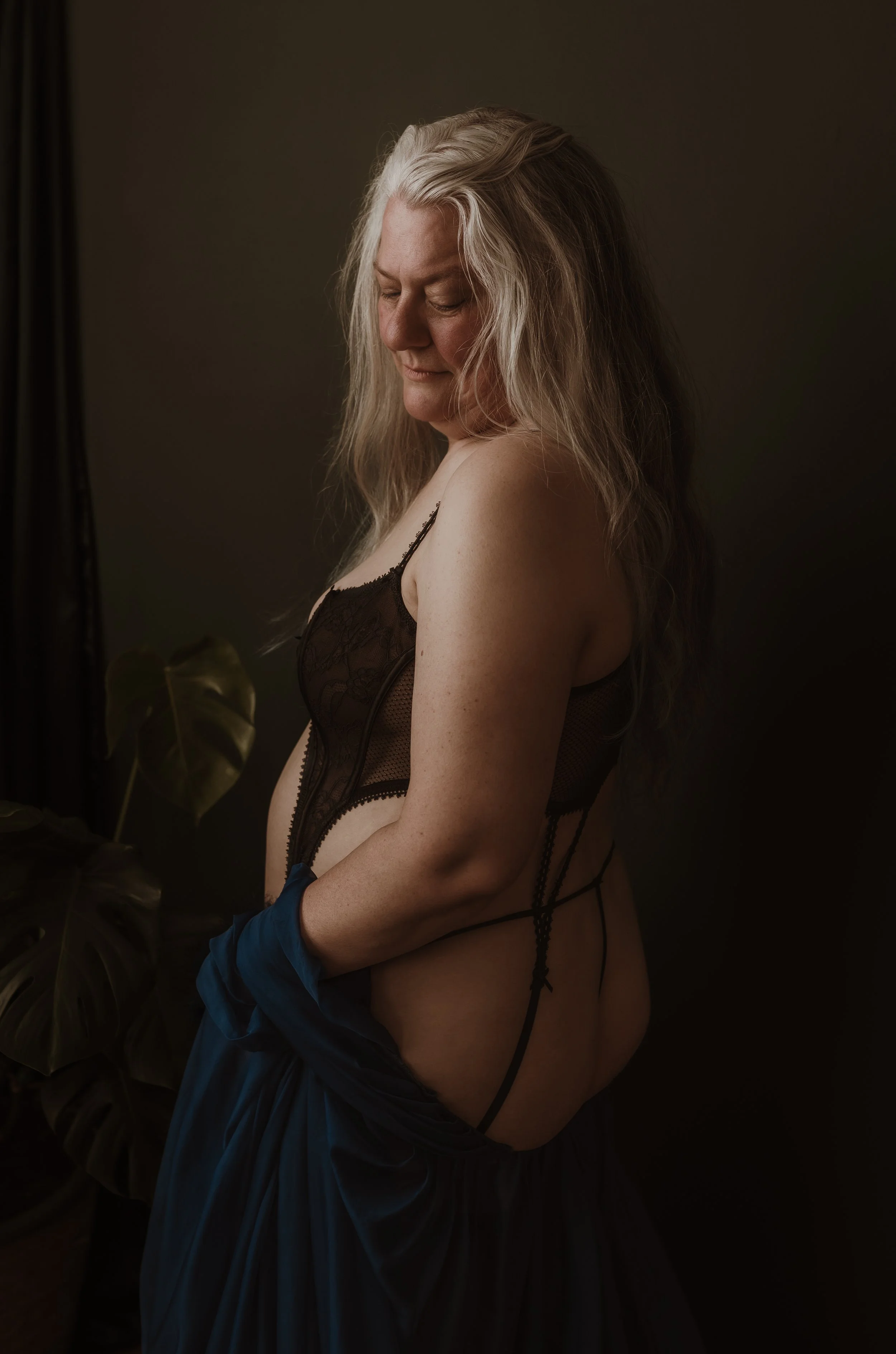 Side profile boudoir portrait at Marieke Captures studio in Glasgow — intimate guided photography session Scotland
