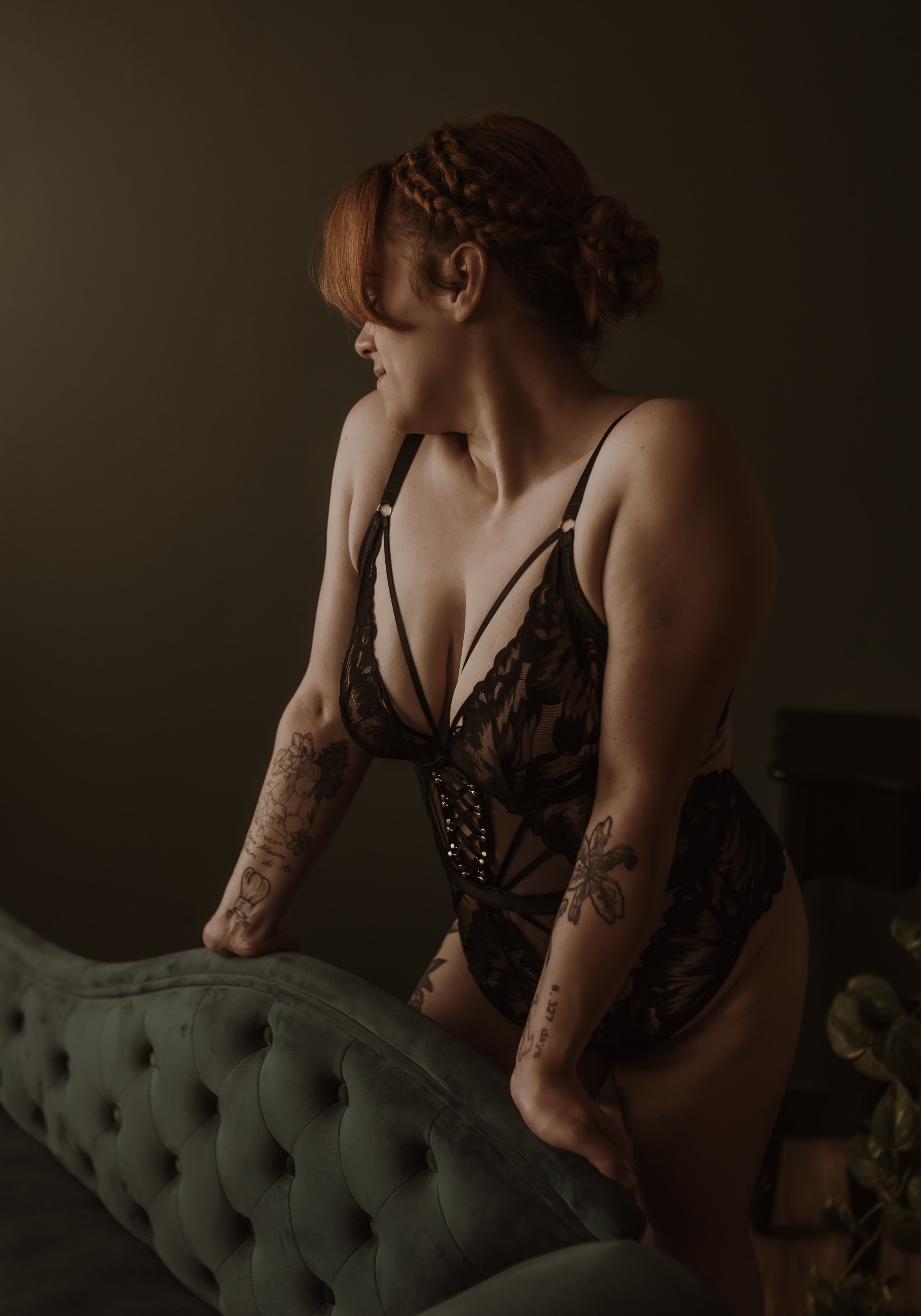 A client in a lace bodysuit from the studio wardrobe during a boudoir session at Marieke Captures, Glasgow. Bring your own or borrow.