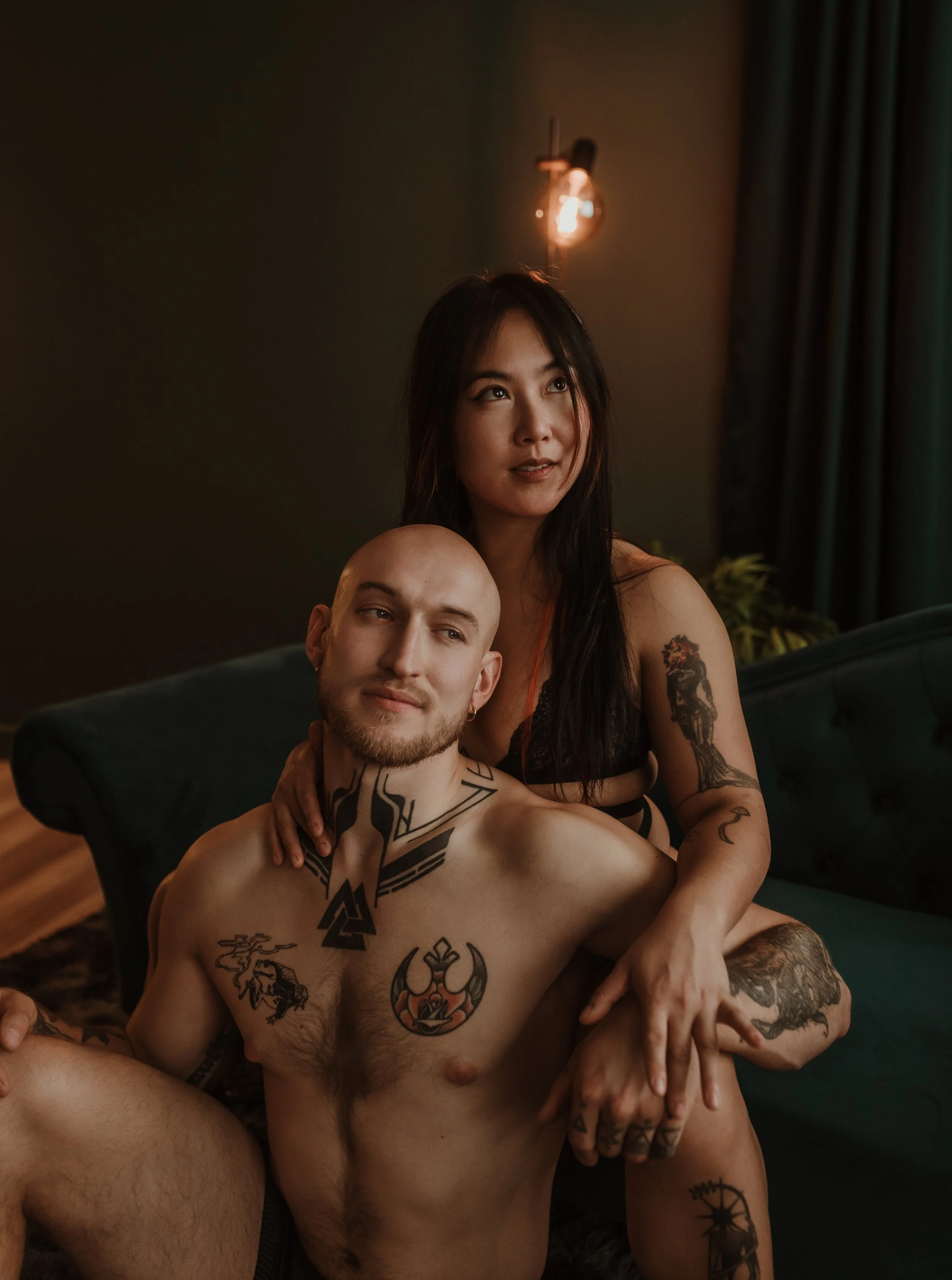 Couple in a warm embrace during a couples boudoir photography session at Marieke Captures studio in Glasgow — celebrating love and connection