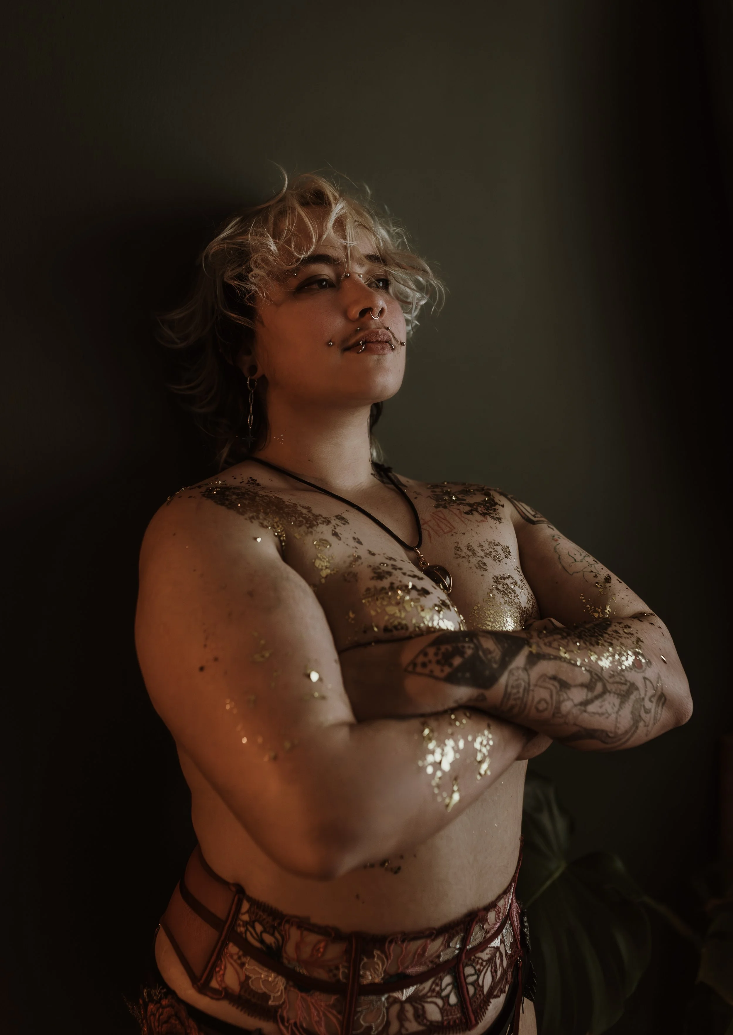 Empowering trans boudoir photography session in Glasgow featuring Orion, celebrating body confidence and queer visibility at Marieke Captures studio, Scotland