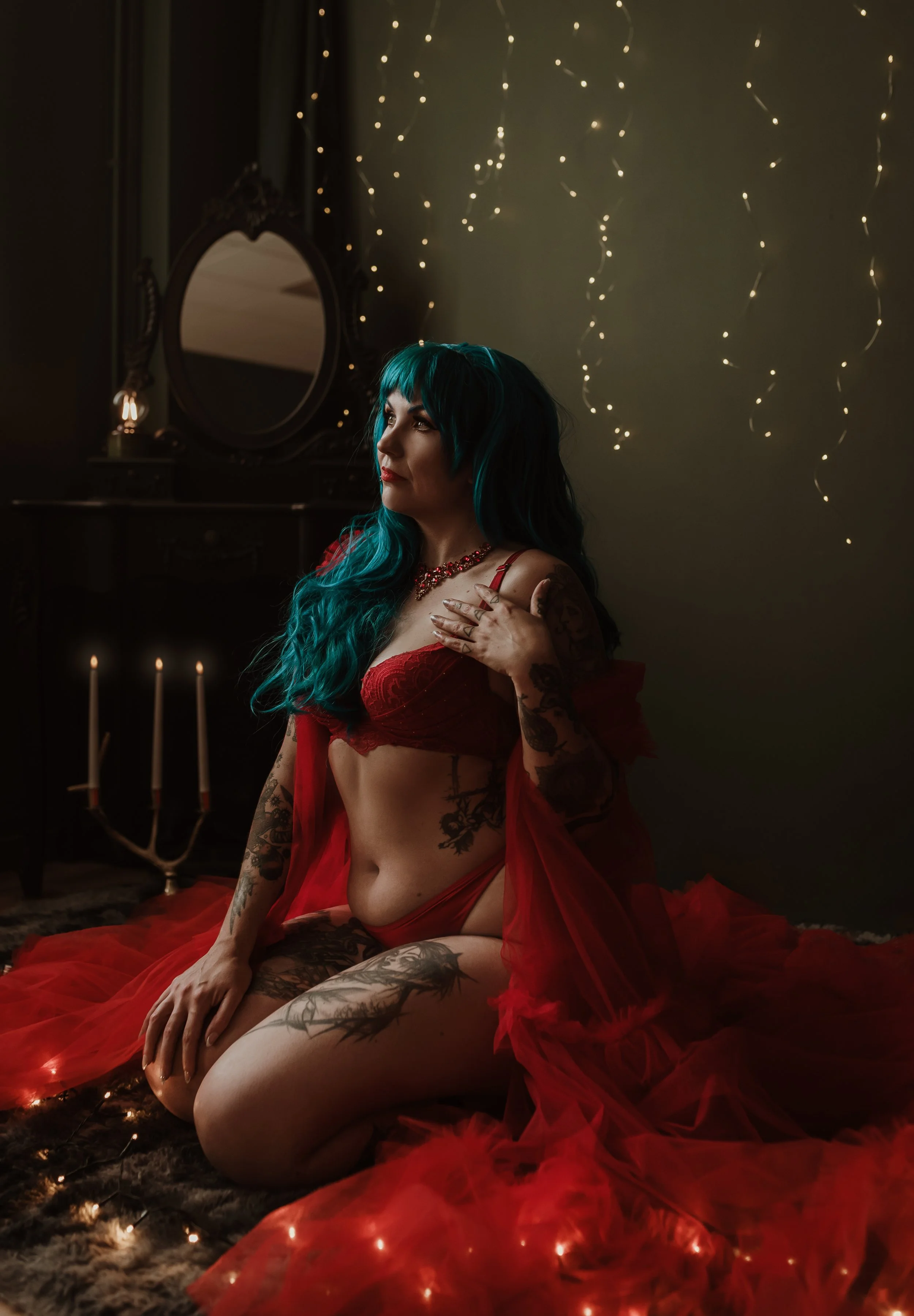 Christmas boudoir portrait in red lace and tulle by candlelight and fairy lights, Marieke Captures studio, Glasgow