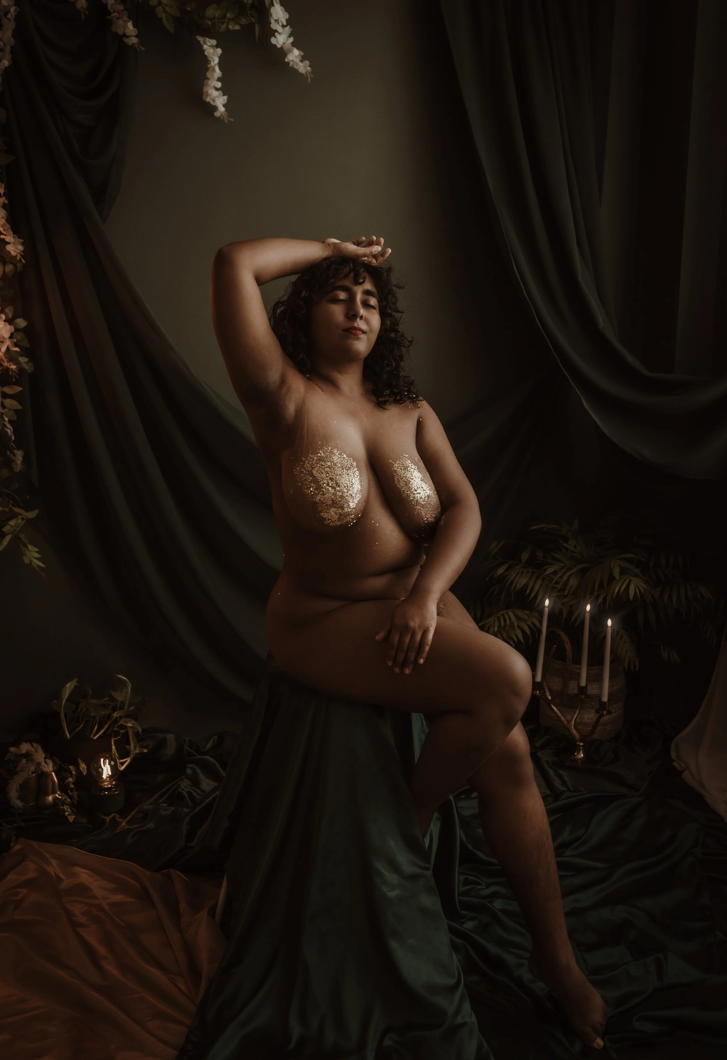 Woman with gold body paint in boudoir photography session at Marieke Captures studio, Glasgow