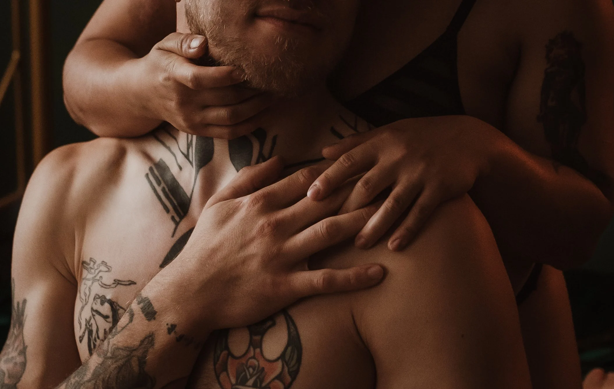 Close-up detail of a couple's hands during an intimate couples boudoir photography session at Marieke Captures studio in Glasgow, Scotland