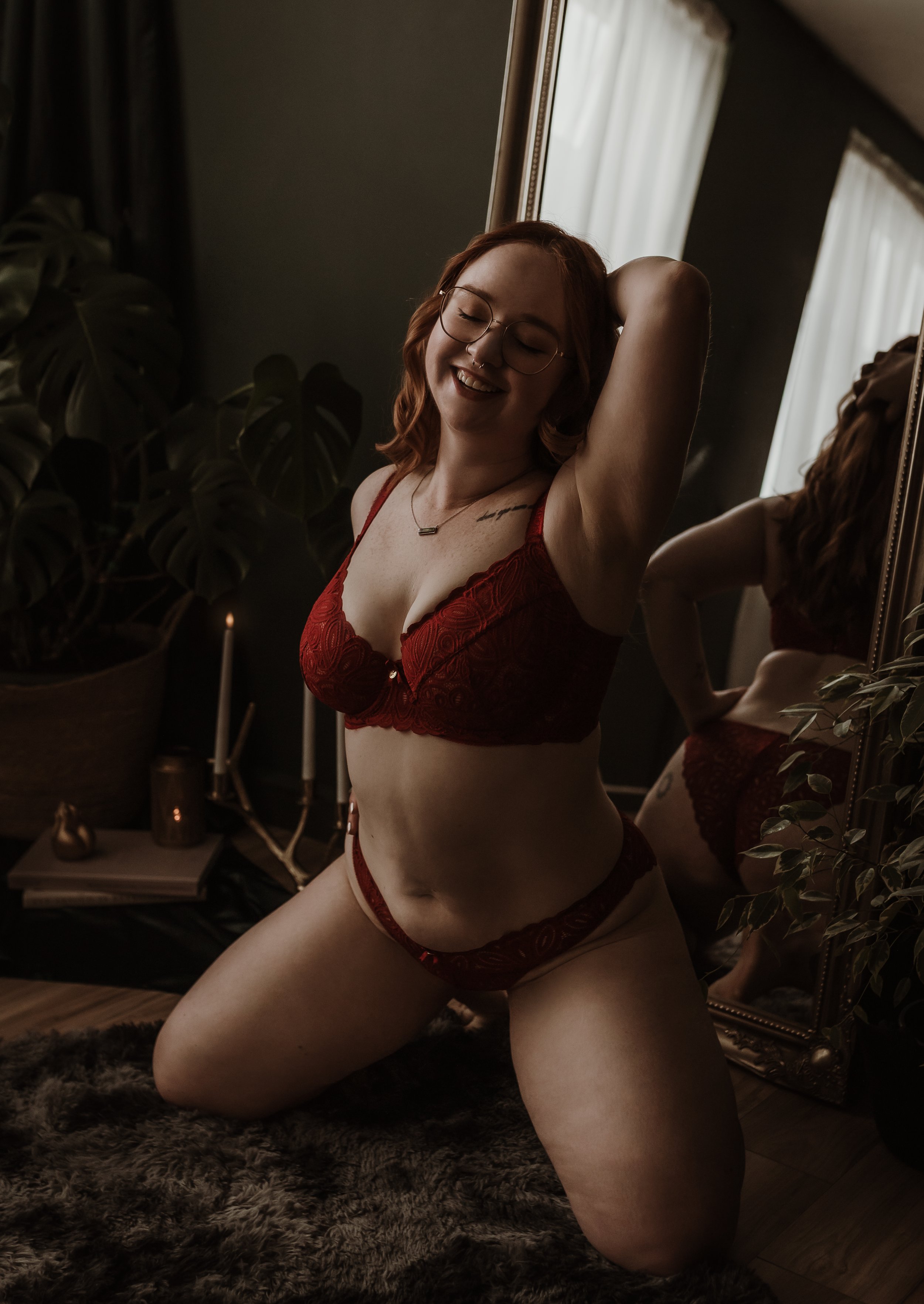 Boudoir photography session at Marieke Captures studio in Glasgow — client laughing during a guided, body-positive shoot