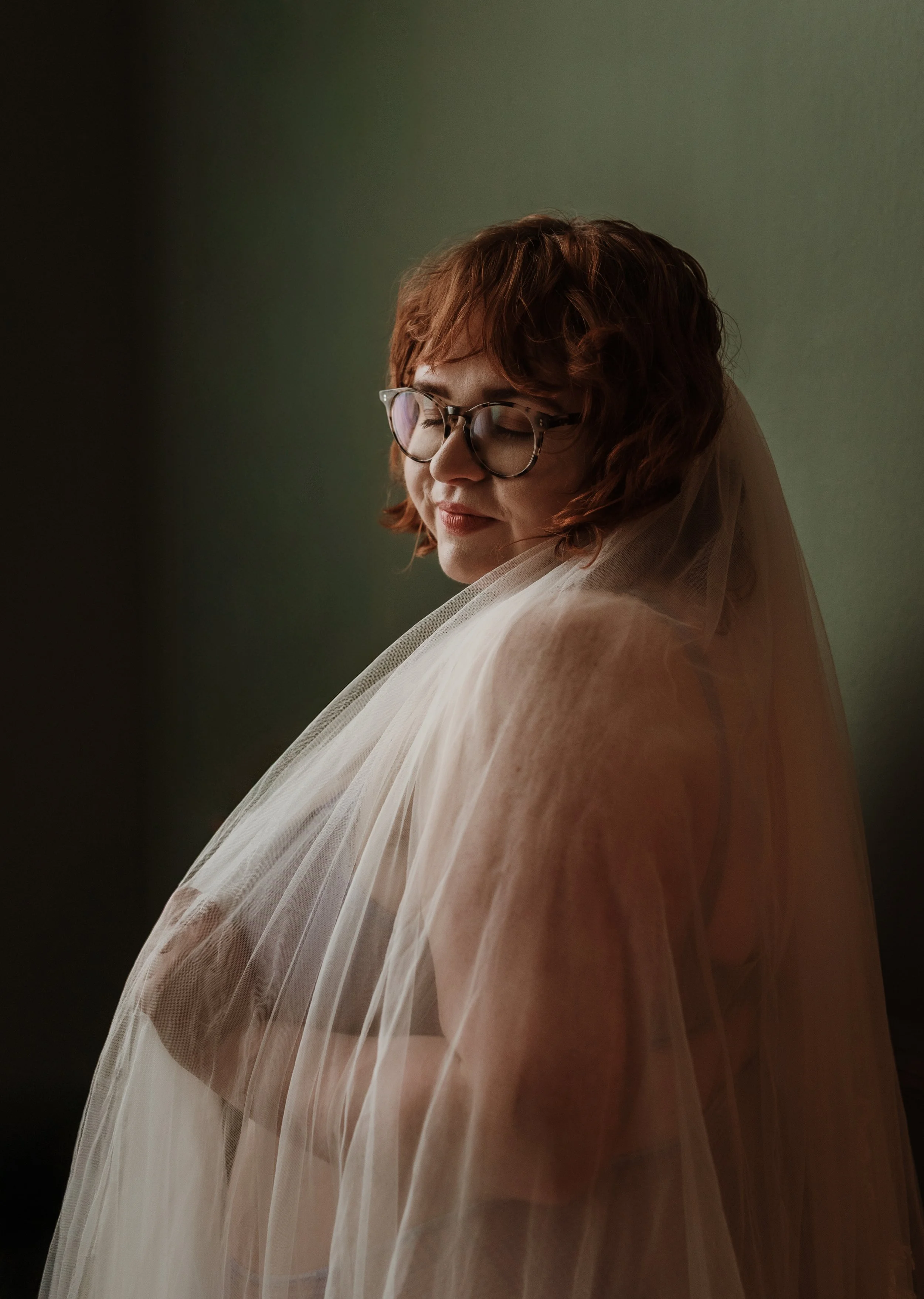 Bridal boudoir photographer Glasgow — woman in wedding veil, intimate studio portrait