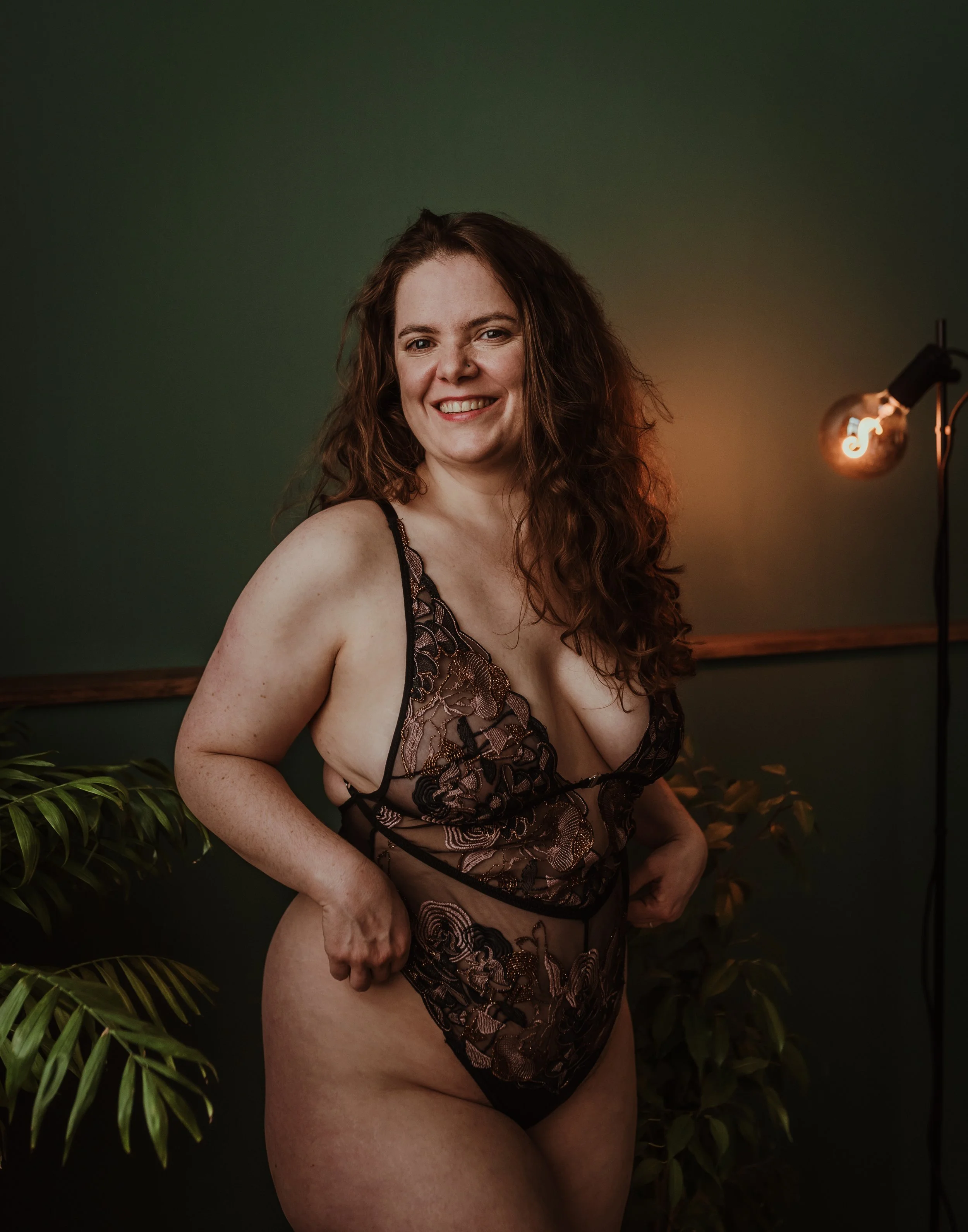 A boudoir portrait taken at Marieke Captures studio in Glasgow, capturing a moment of genuine confidence and self-acceptance during a fully guided photography experience.