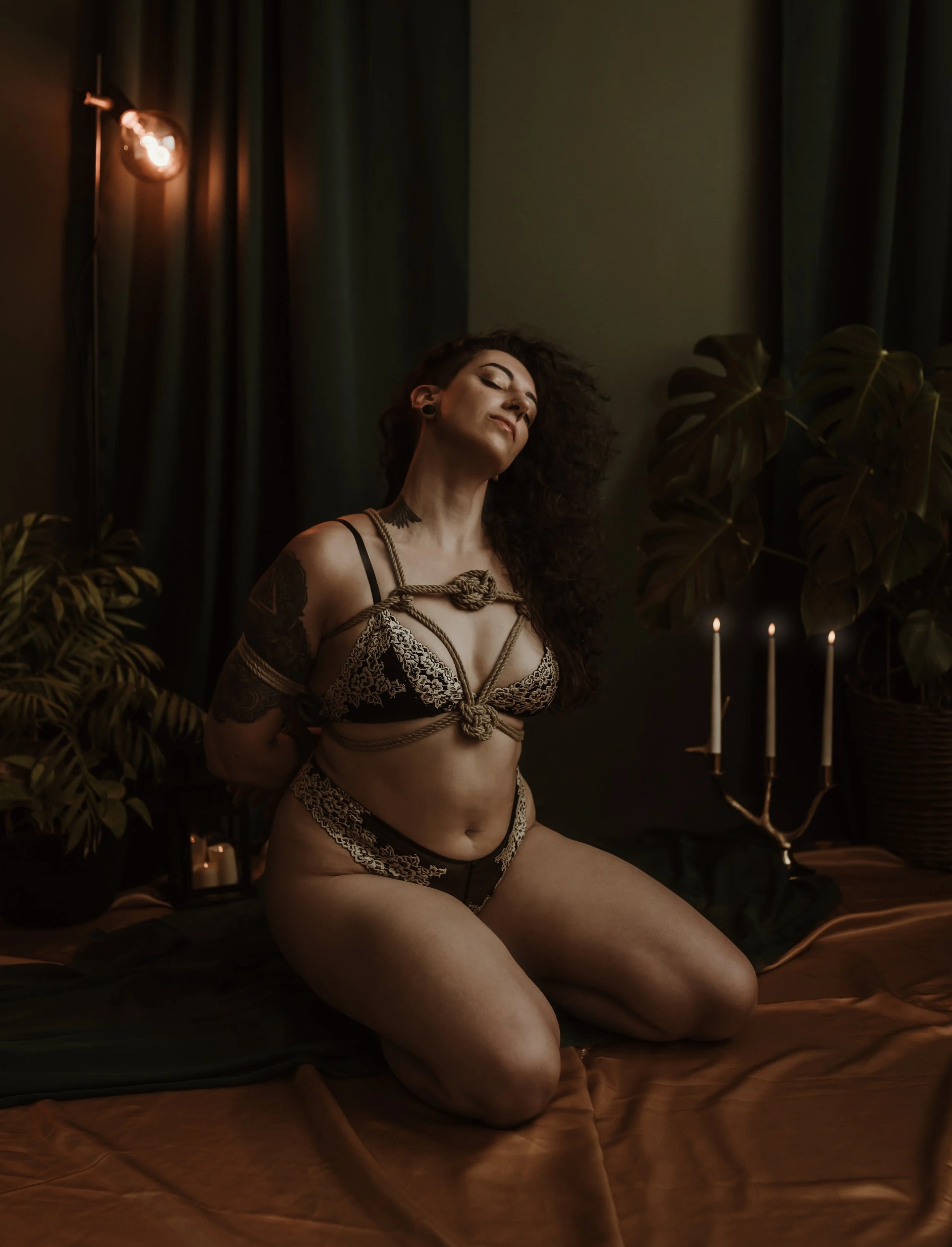 Intimate boudoir portrait of a woman using shibari as a form of self-expression and embodied connection, Marieke Captures studio, Glasgow