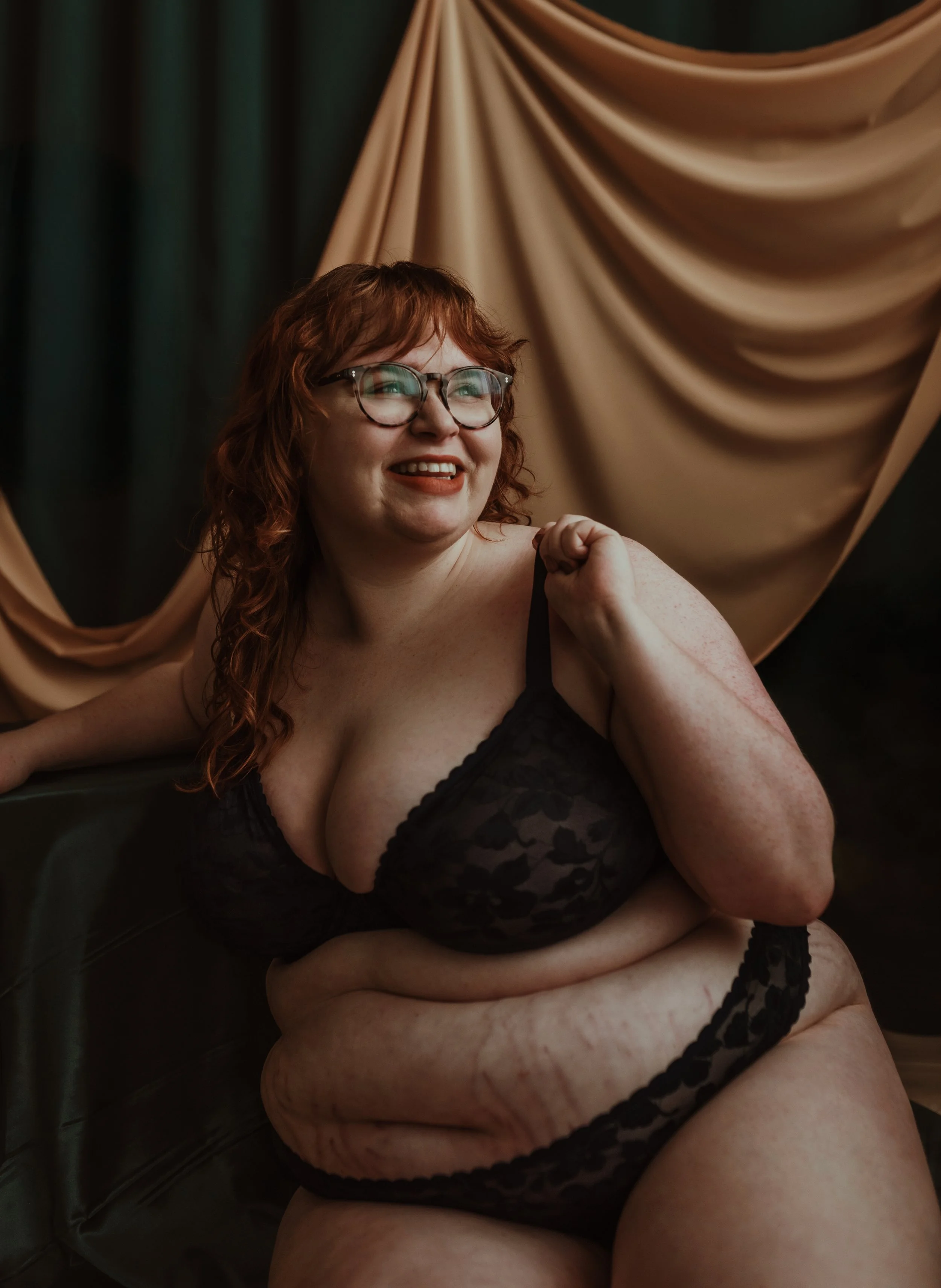Woman looking directly into the lens during a confidence boudoir photography session at Marieke Captures studio in Glasgow, Scotland — unafraid to be seen