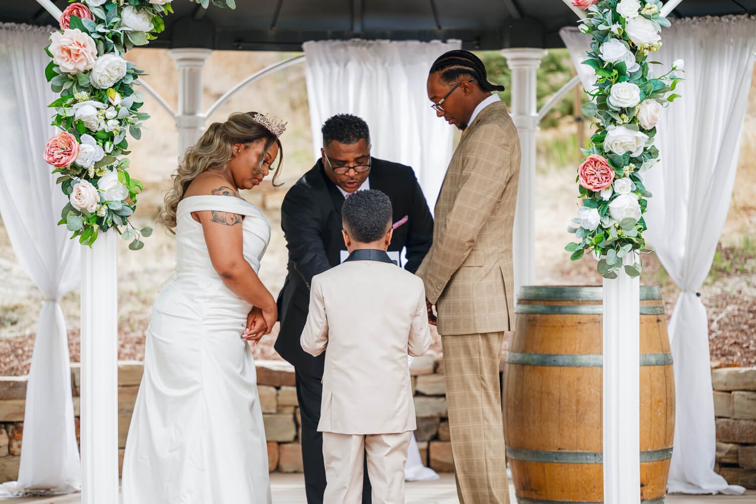 colorado-springs-wedding-photographer-bride-and-groom-praying.jpg