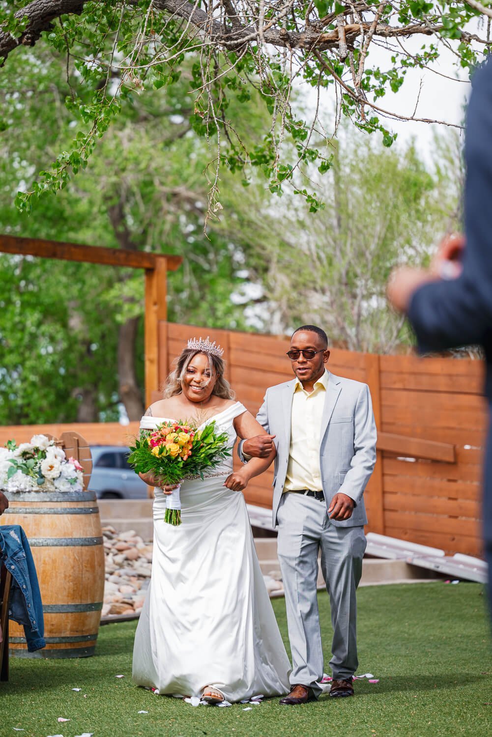 colorado-springs-wedding-photographer-bride-walking-down-aisle.jpg