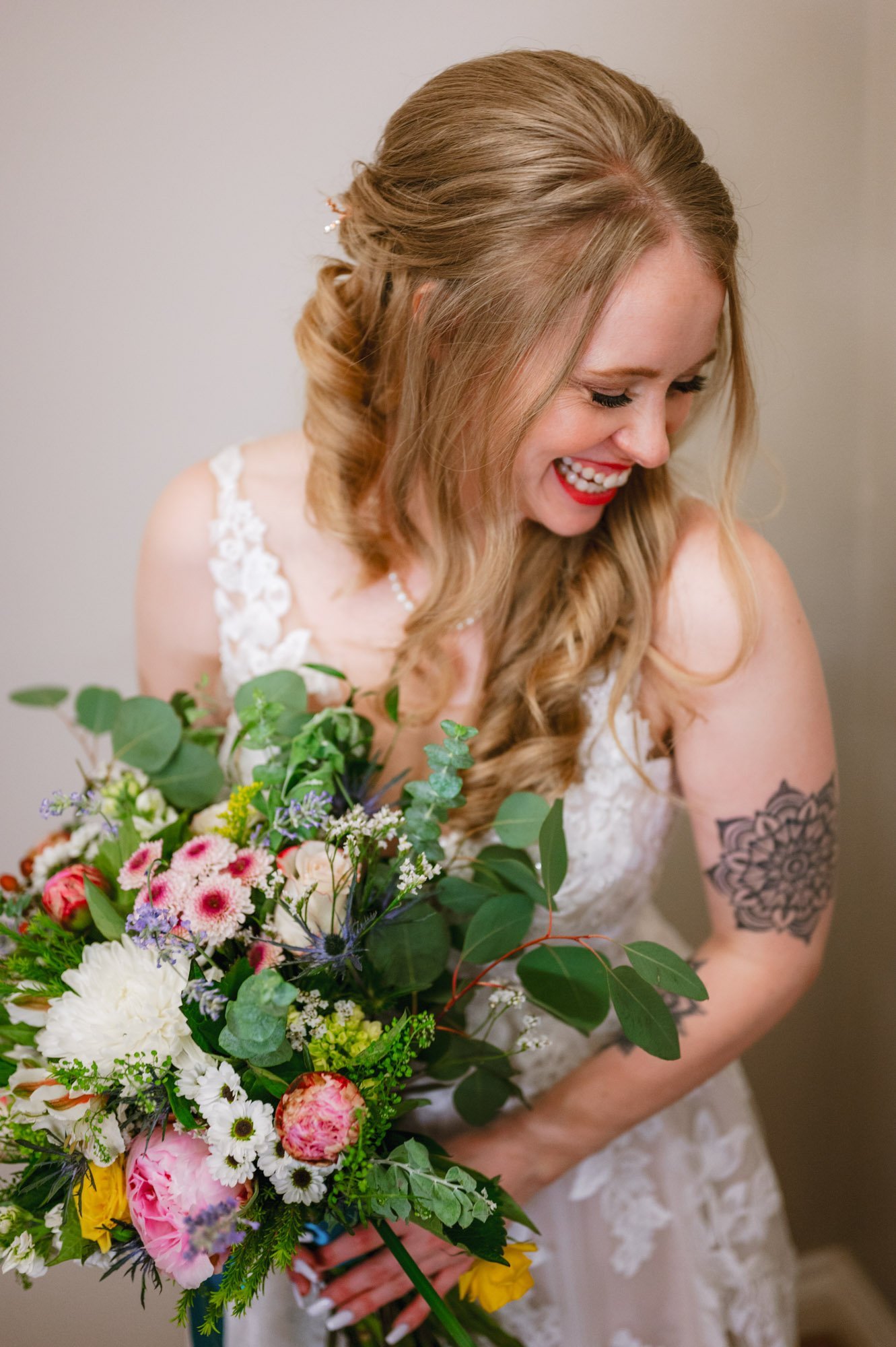 denver bride posing with her flowers