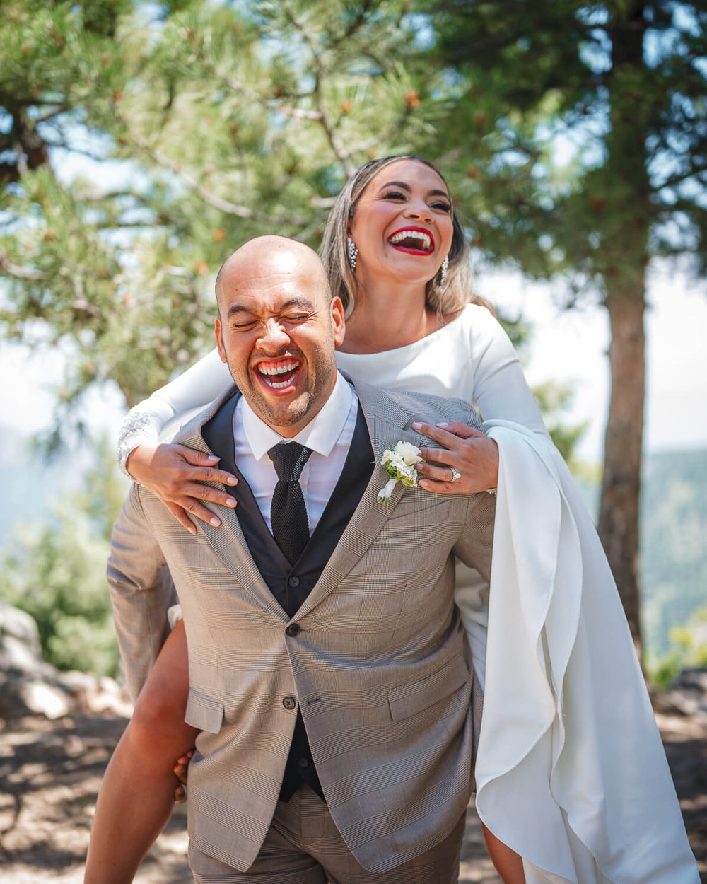 boulder-wedding-photography-bride-and-groom-piggyback.jpg