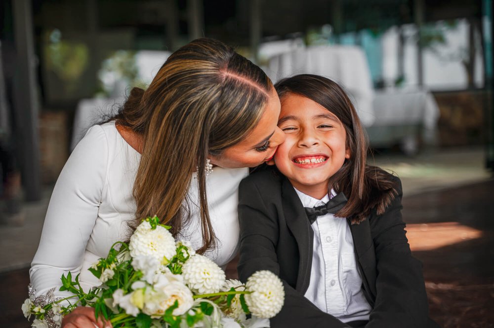 boulder-wedding-photography-bride-kisses-her-son.jpg