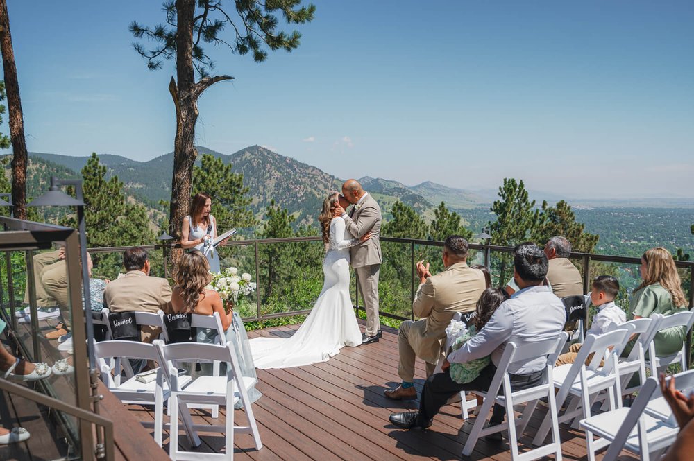 boulder-wedding-photography-first-kiss-with-mountain-background.jpg