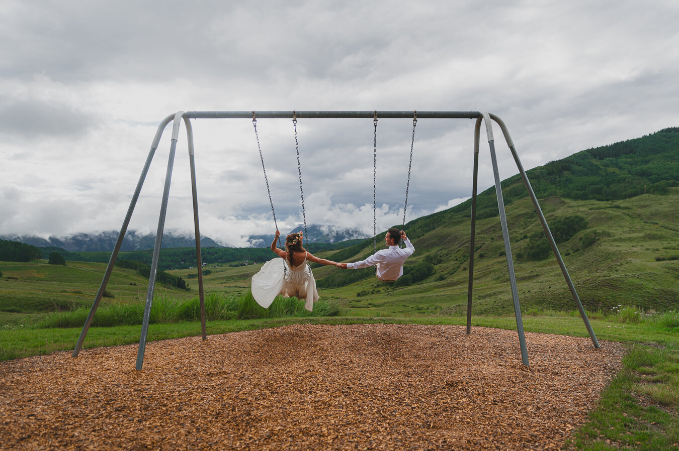 Name one thing cuter than swinging on a swingset with your spouse on your wedding day ... I'll wait.

Venue: @mountainweddinggarden 
Planner: @luckypennyevents 
DJ: @shavanosoundz 
Florist: @finallyfloral 
Food: @sherpacafe 
Bar: @sidecarmobilebar 
.