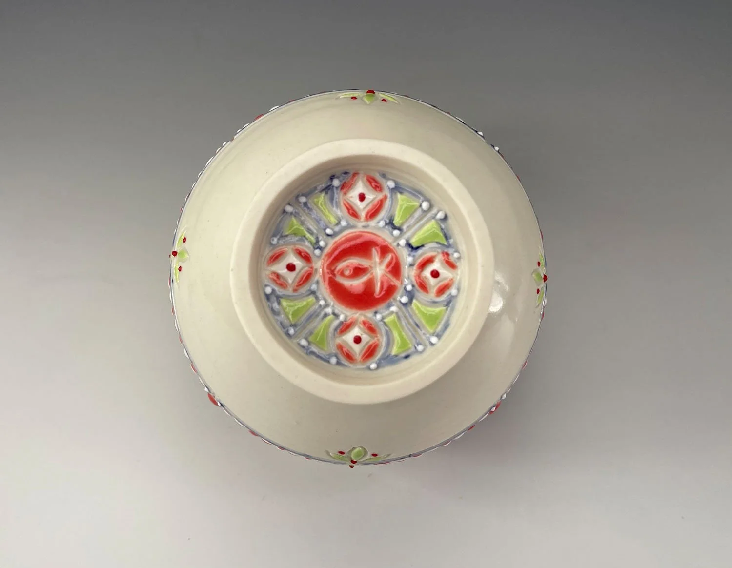 Bottom of Twelve ounce porcelain wine cup with unique checkerboard design and periwinkle liner