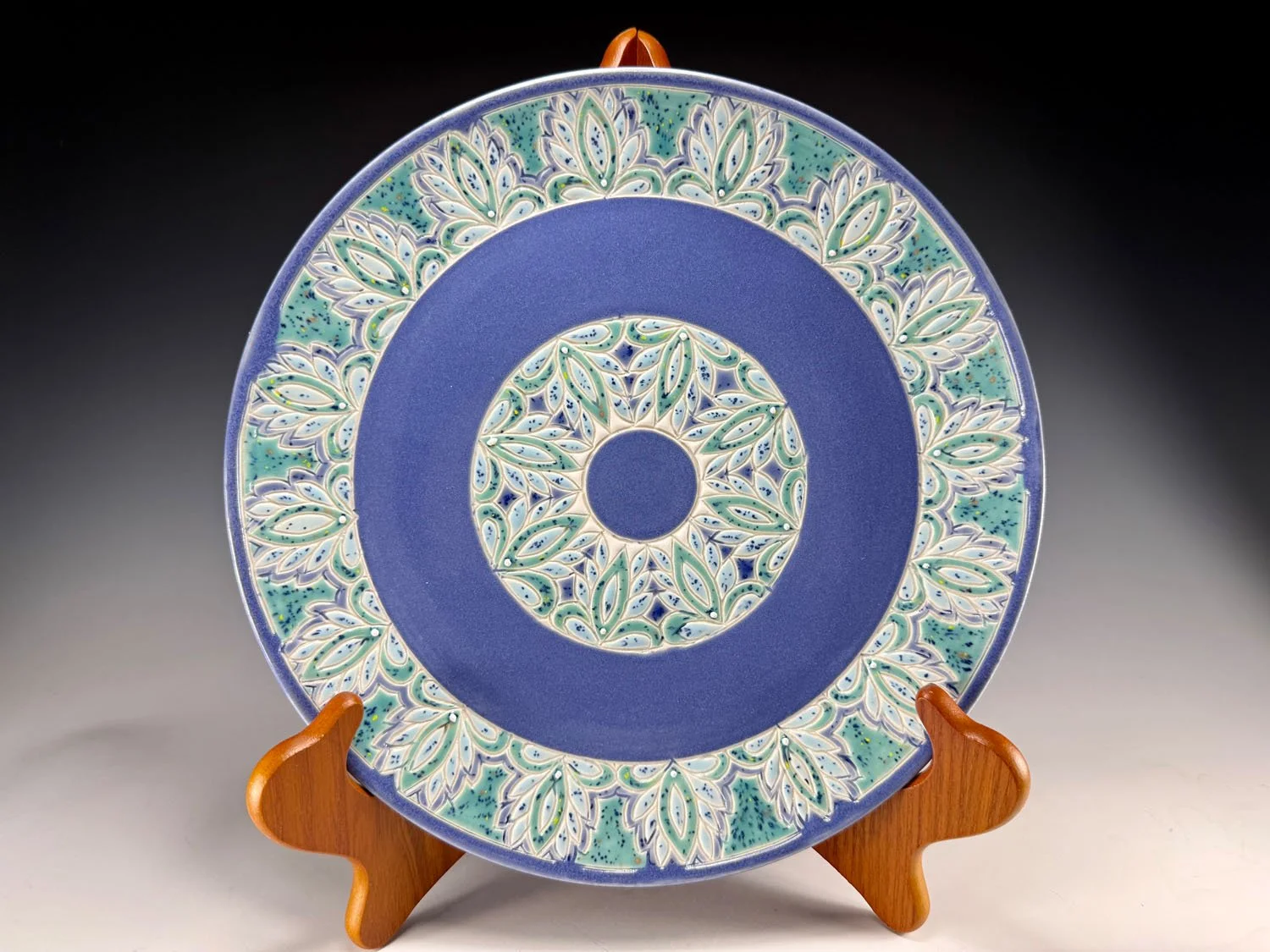 Porcelain plate with green blue border and periwinkle blue base