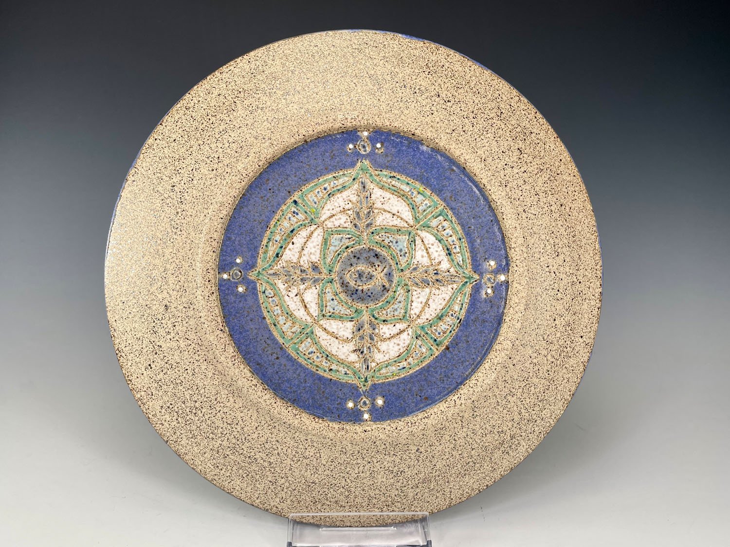 Back carving on Compass carved stoneware plate
