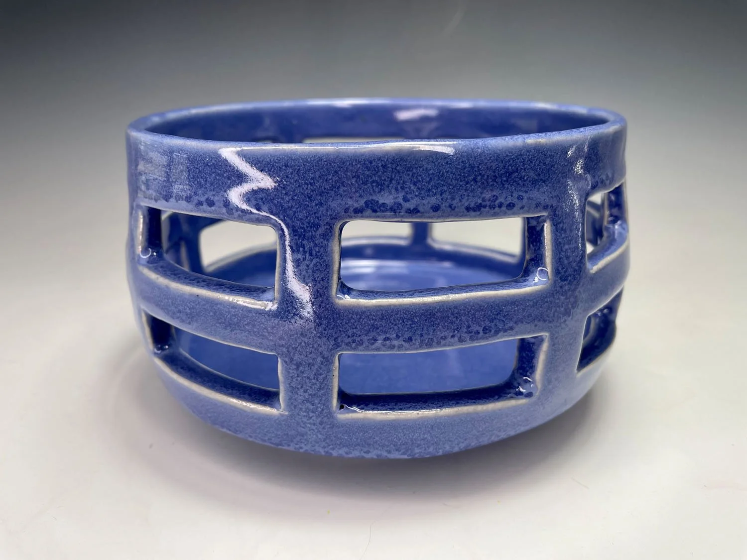 Blue cutout stoneware basket