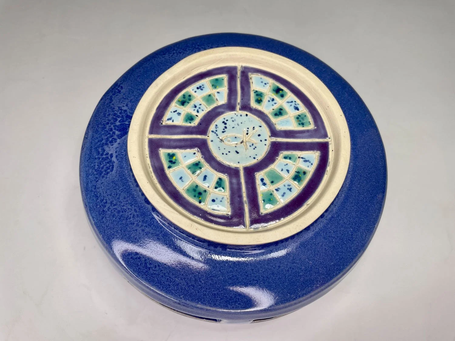 Bottom view of Blue cutout stoneware basket