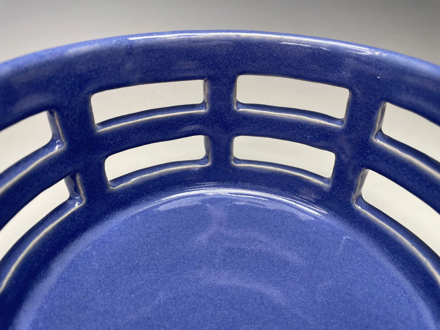 Interior view of Blue cutout stoneware basket