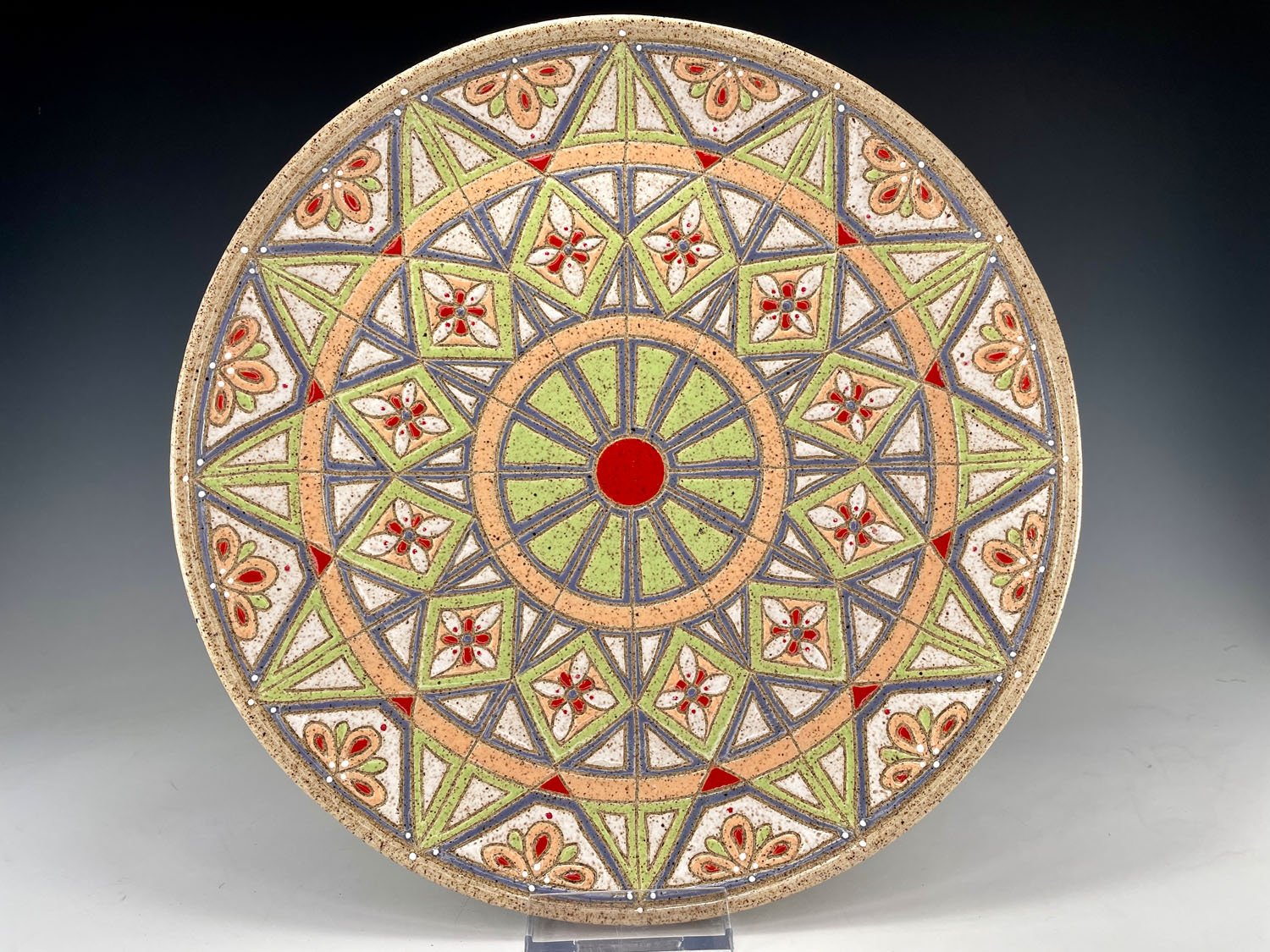 Intricately carved stoneware serving plate