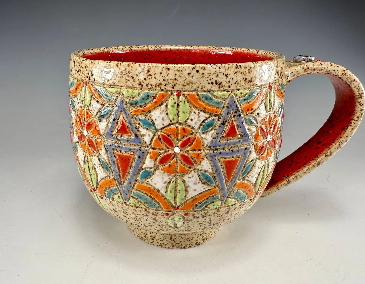 Hand carved stoneware mug