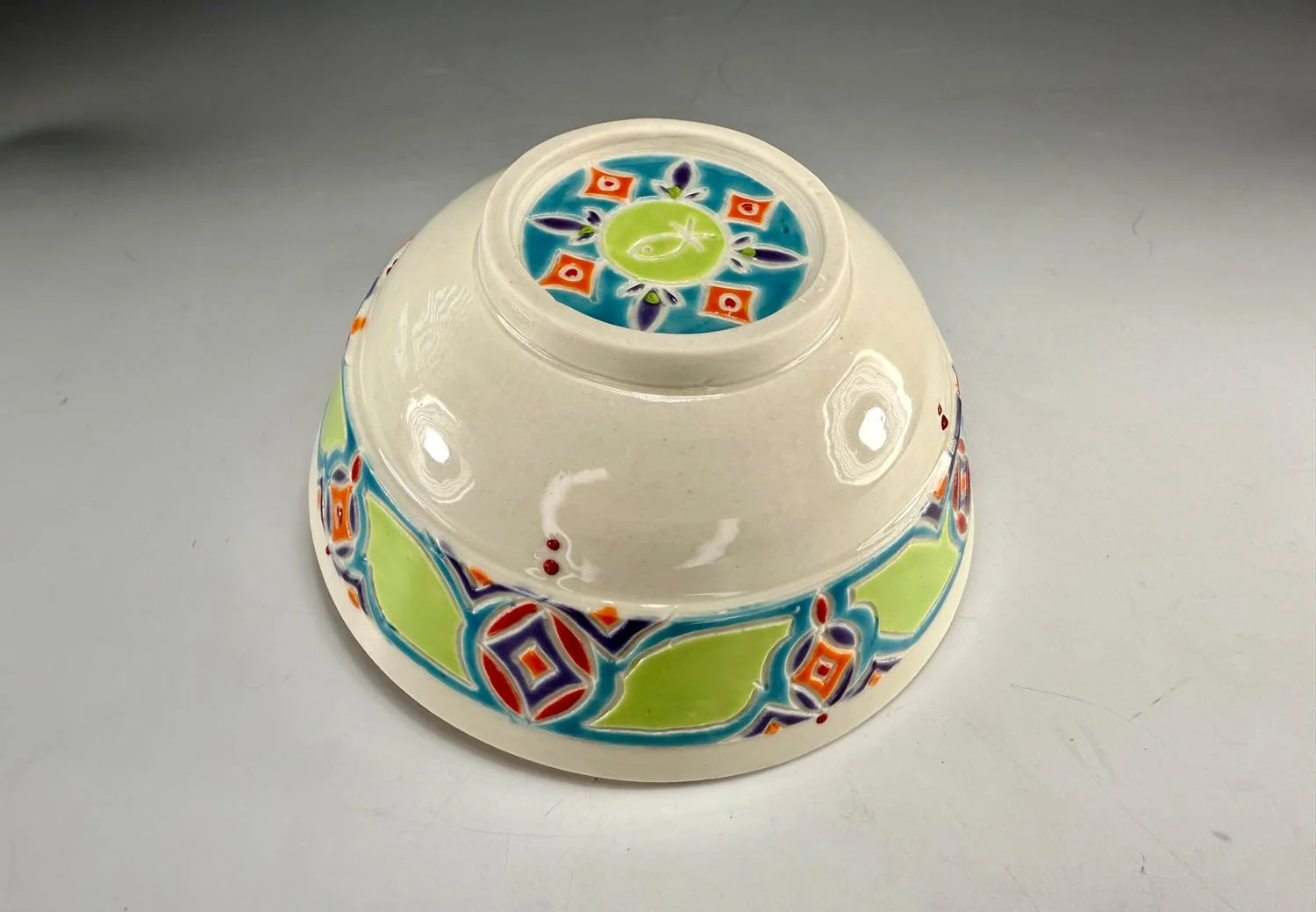 Bottom of bowl 1 Tangerine lined porcelain two bowl snack set with carved outer bands