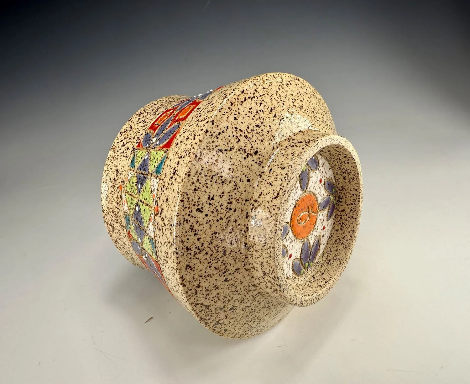 Side view of Carved small stoneware bowl
