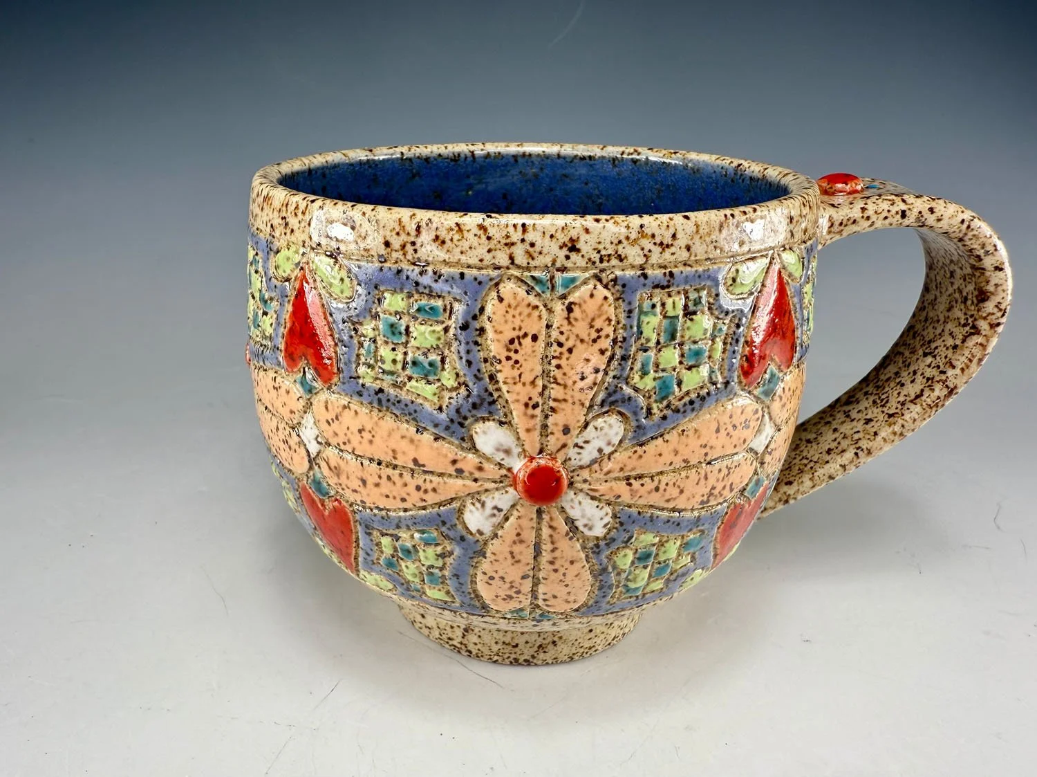 Carved stoneware mug