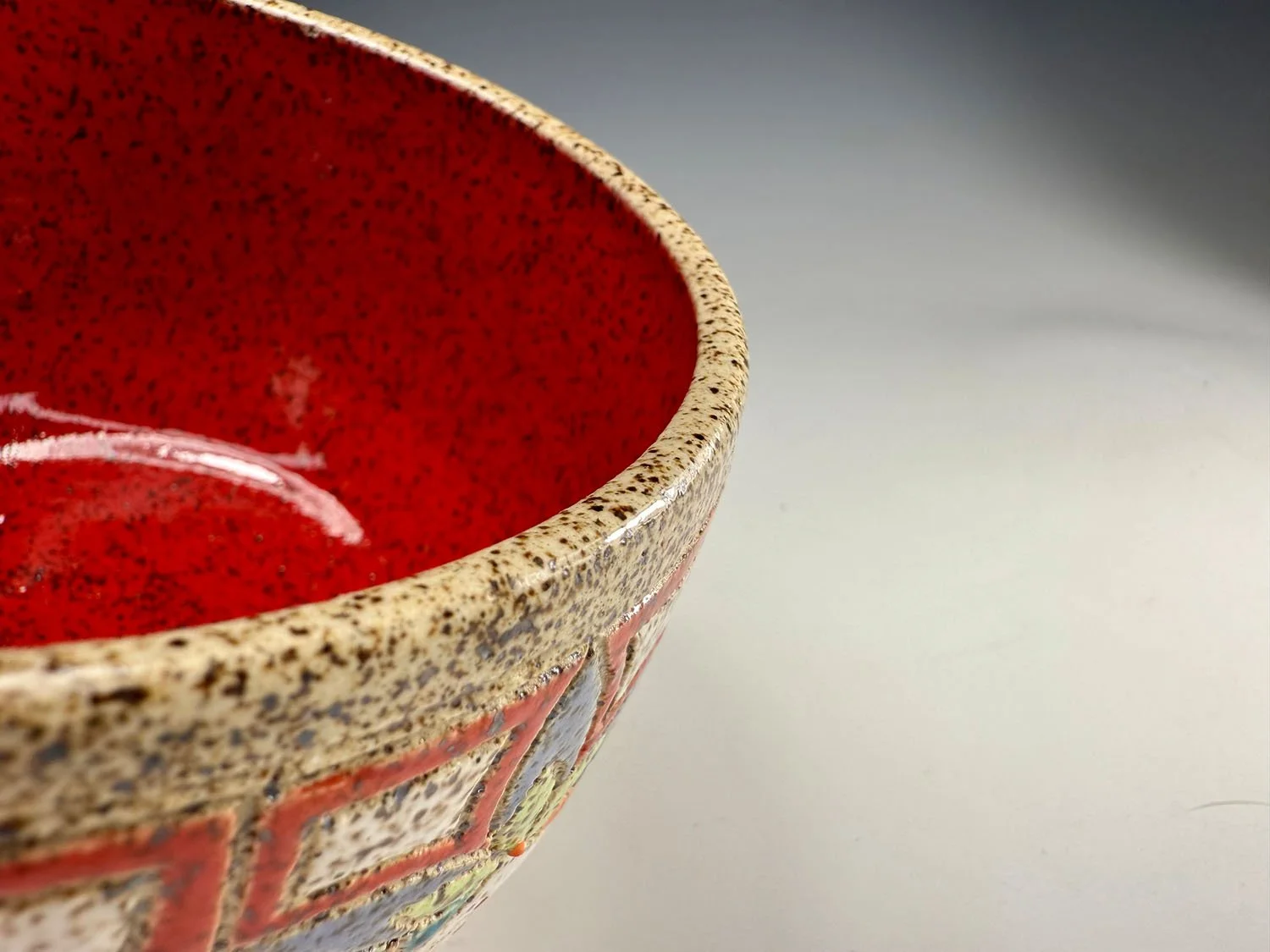 Interior red bowl of Stoneware bowl and spoon set