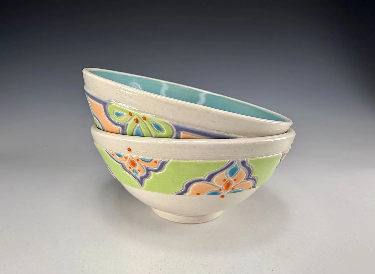 Porcelain snack bowl set w blue liner and hand carved outer designs