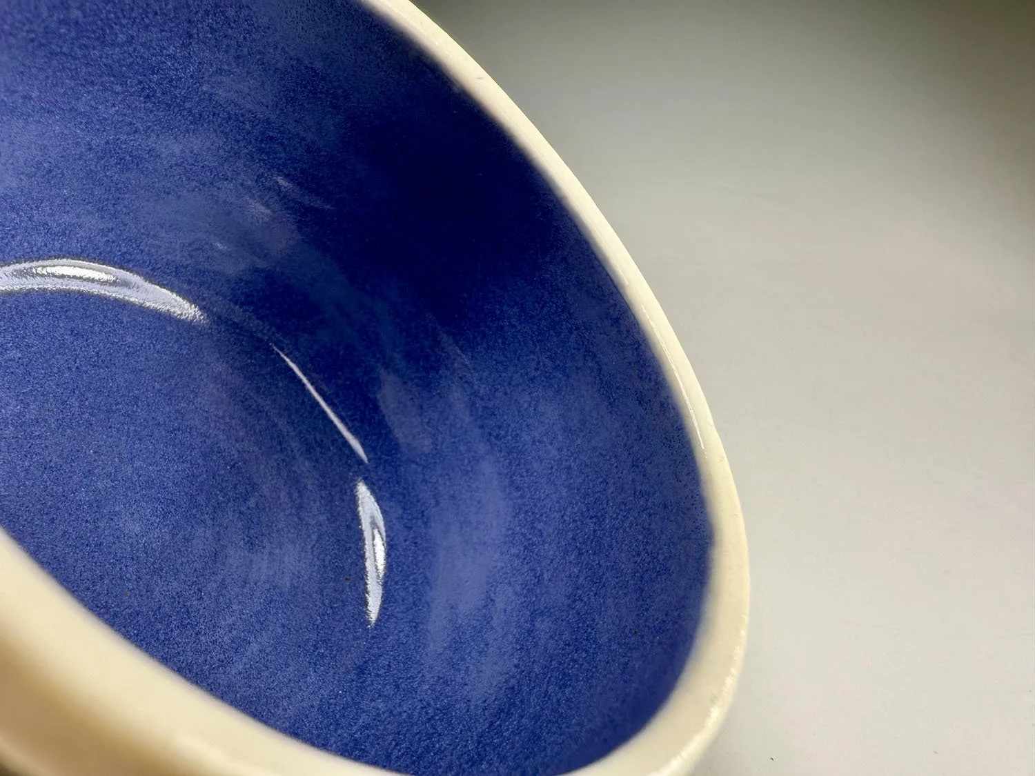 Interior blue of Purple blue carved porcelain mug