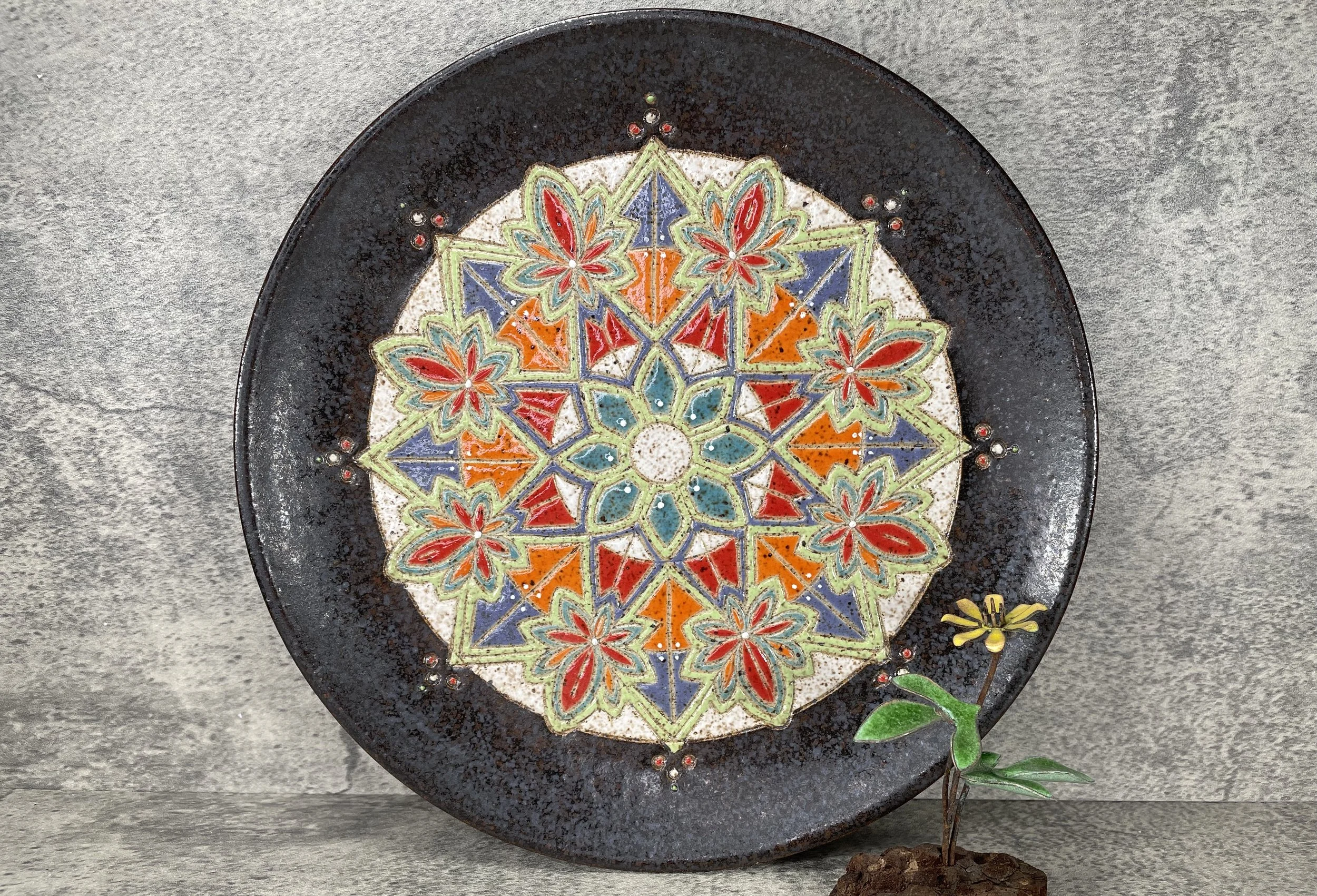 Hand carved stoneware mandala w textured background