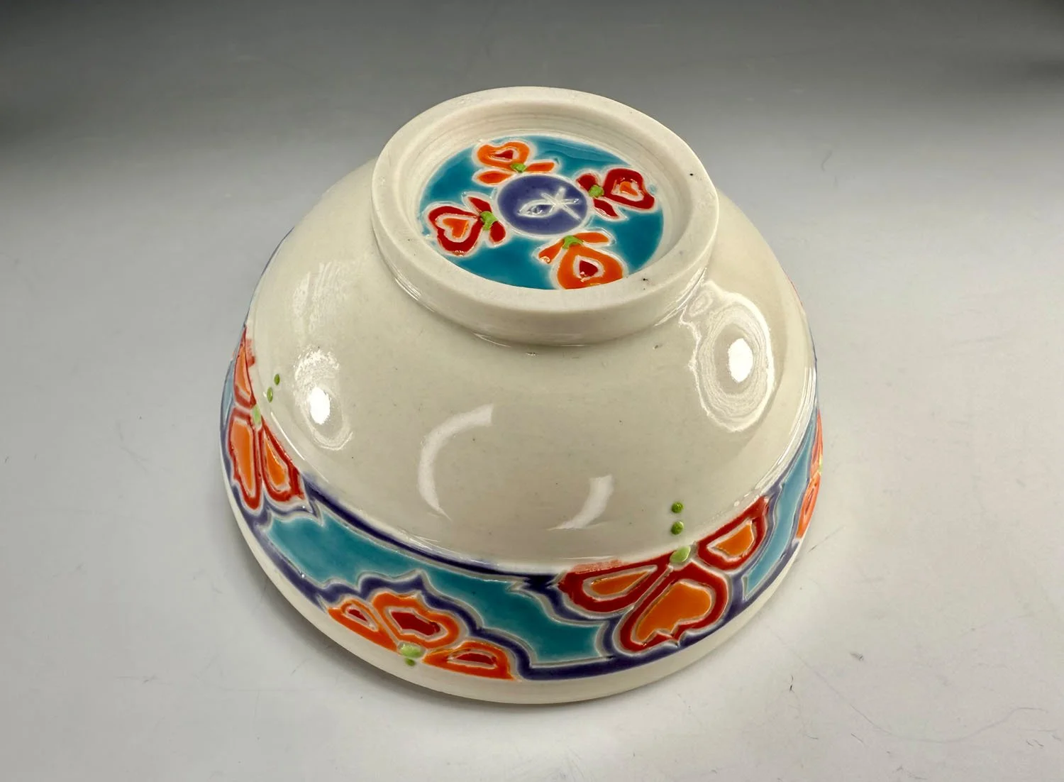 Bottom design bowl 1 of Porcelain snack set w red liner and carved outer designs