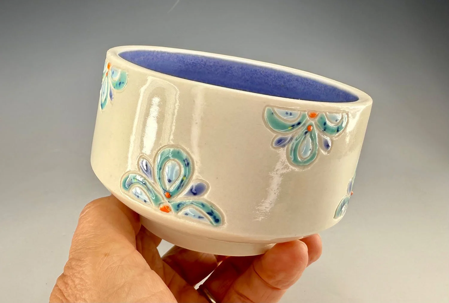 Hand holding Porcelain carved snack bowl