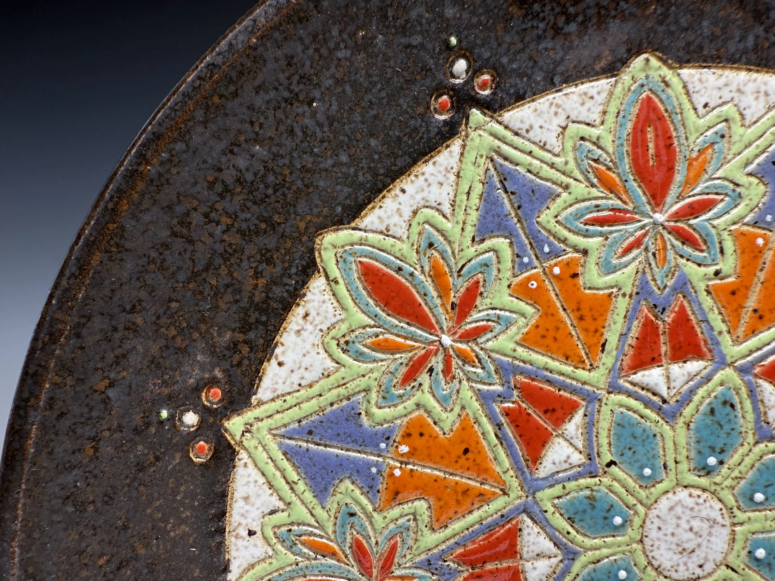 Closeup detail of Hand carved stoneware mandala