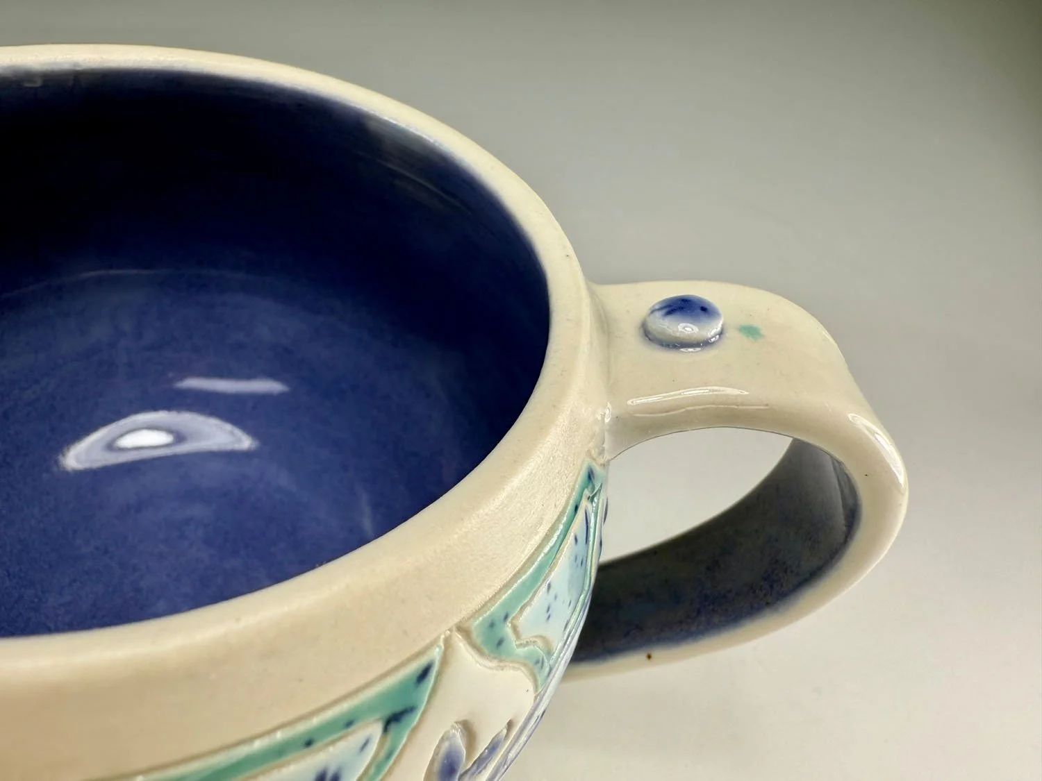 Interior of Carved Blue Green Porcelain Mug