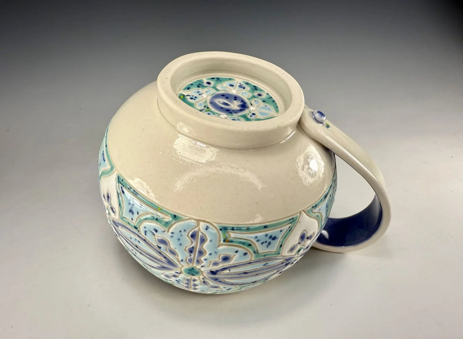 Bottom of Carved Blue Green Porcelain Mug