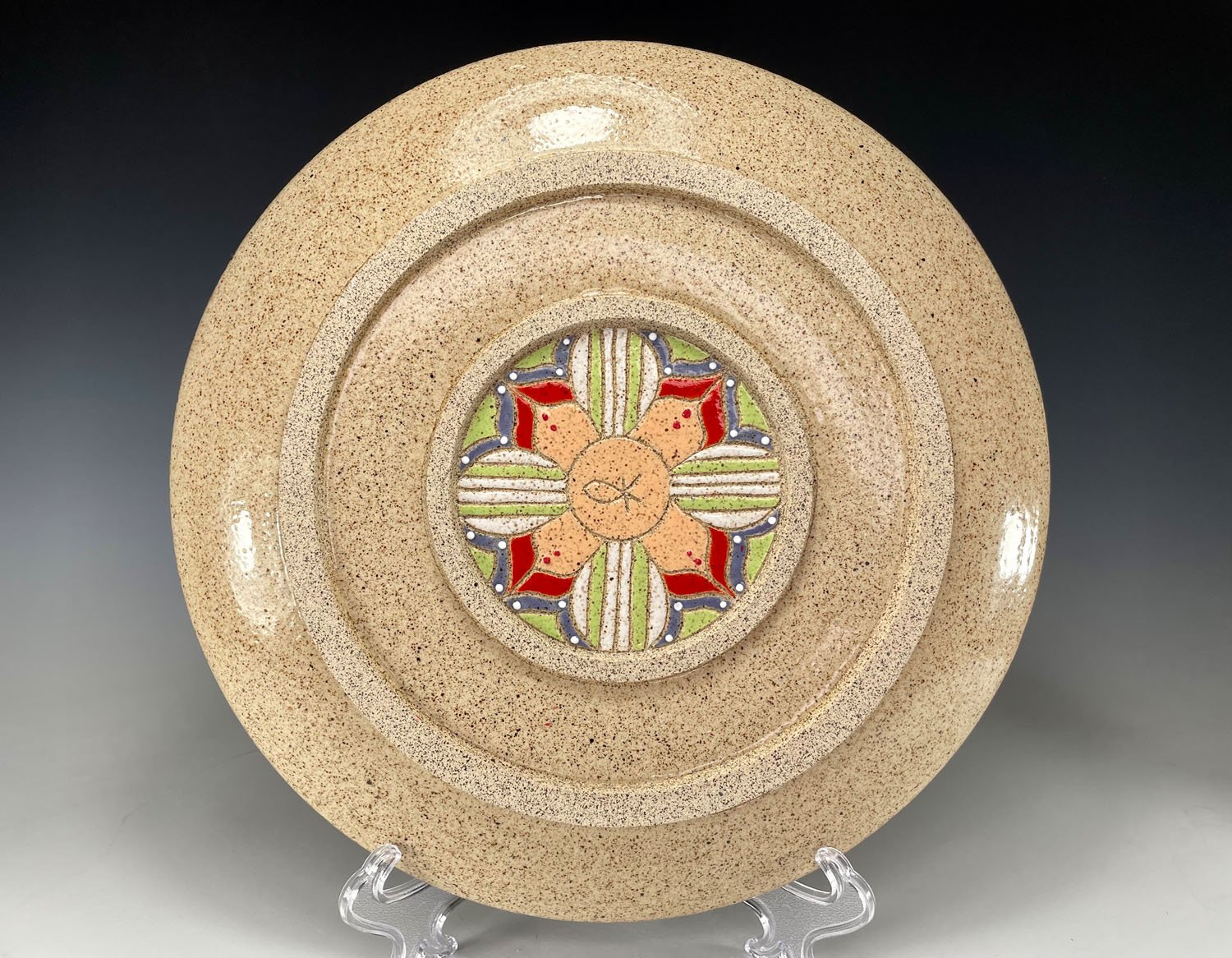 Back design on Carved stoneware serving plate