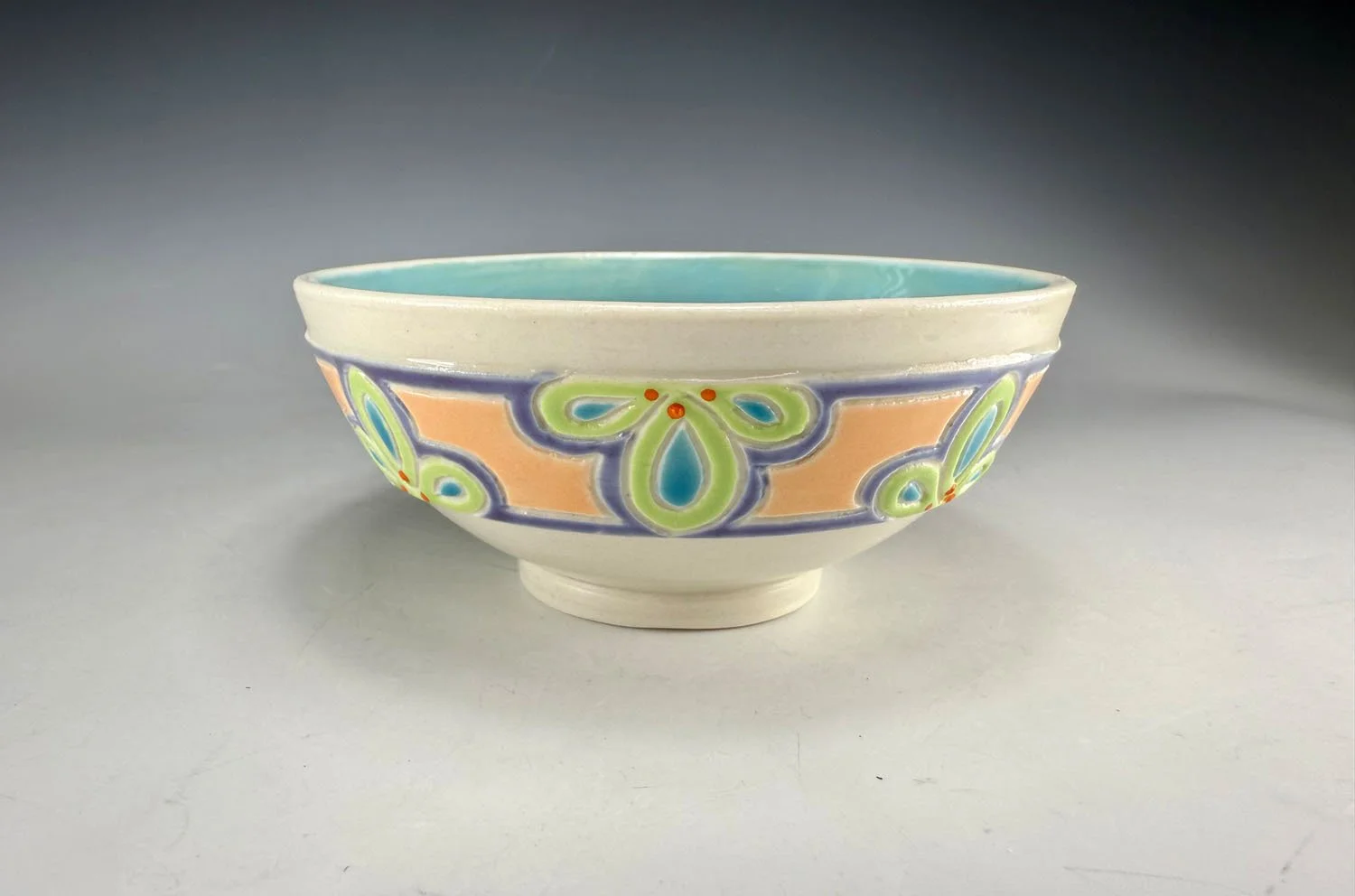 Bowl 2 of Porcelain snack bowl set w blue liner and hand carved outer designs