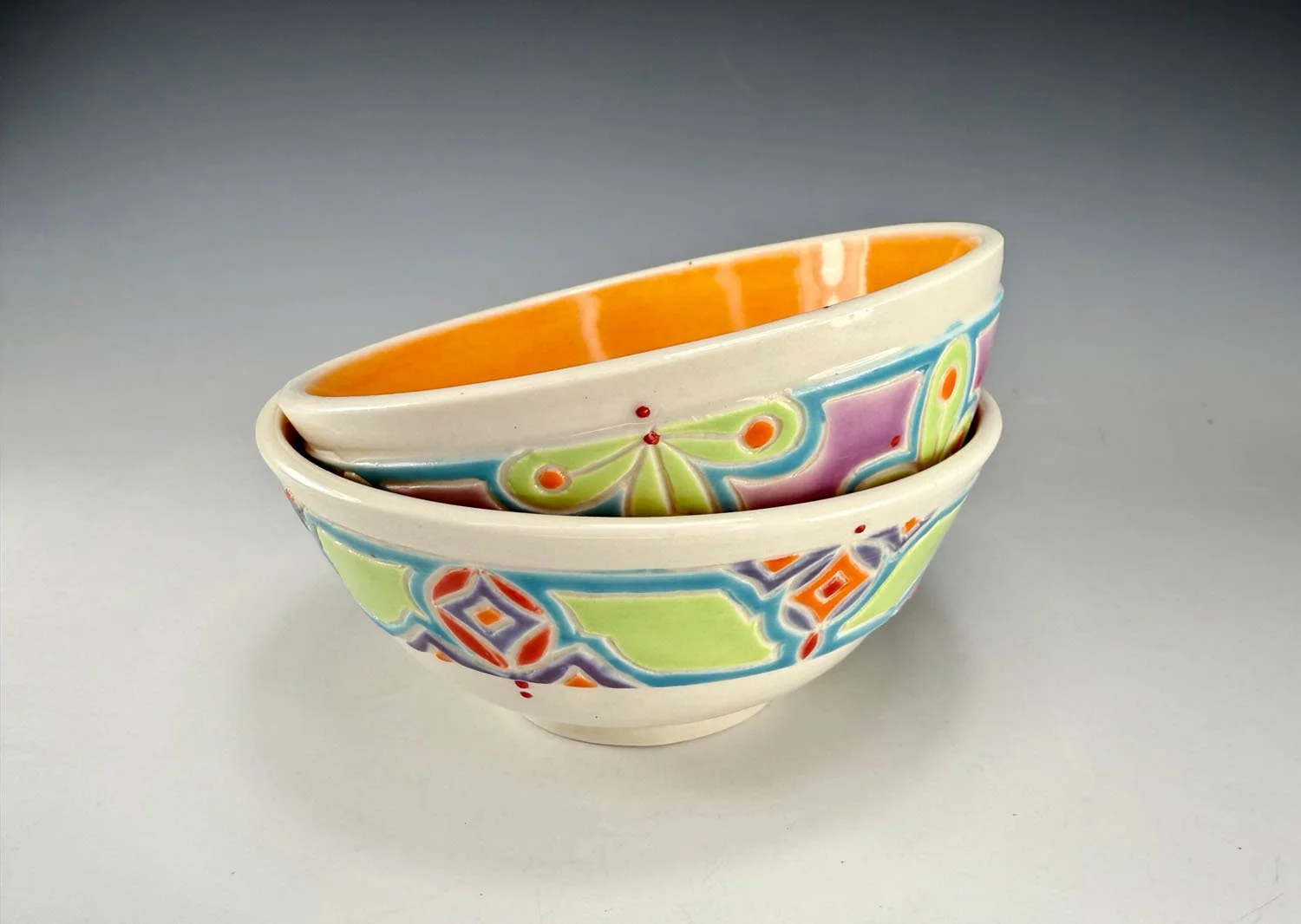 Tangerine lined porcelain two bowl snack set with carved outer bands