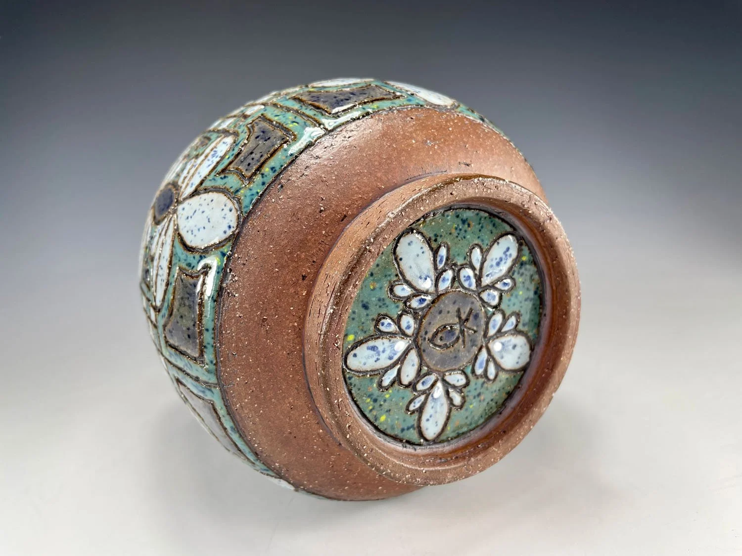 Carved bottom of Hand carved blue green stoneware flowerpot