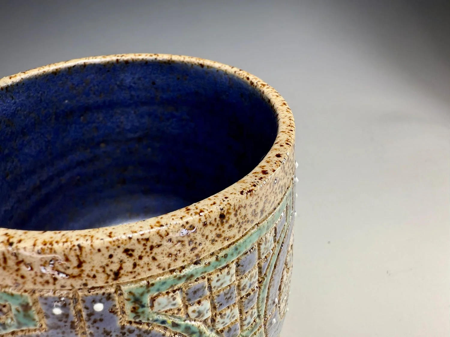 Interior blue of Blue green stoneware bowl handleless mug