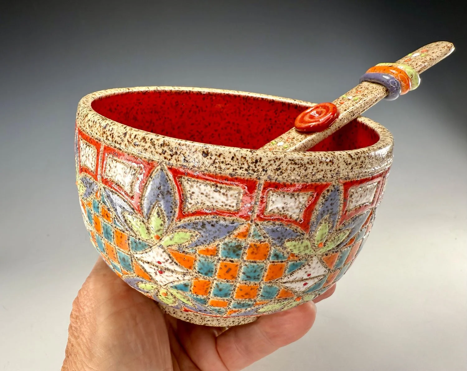 Hand holding Stoneware bowl and spoon set