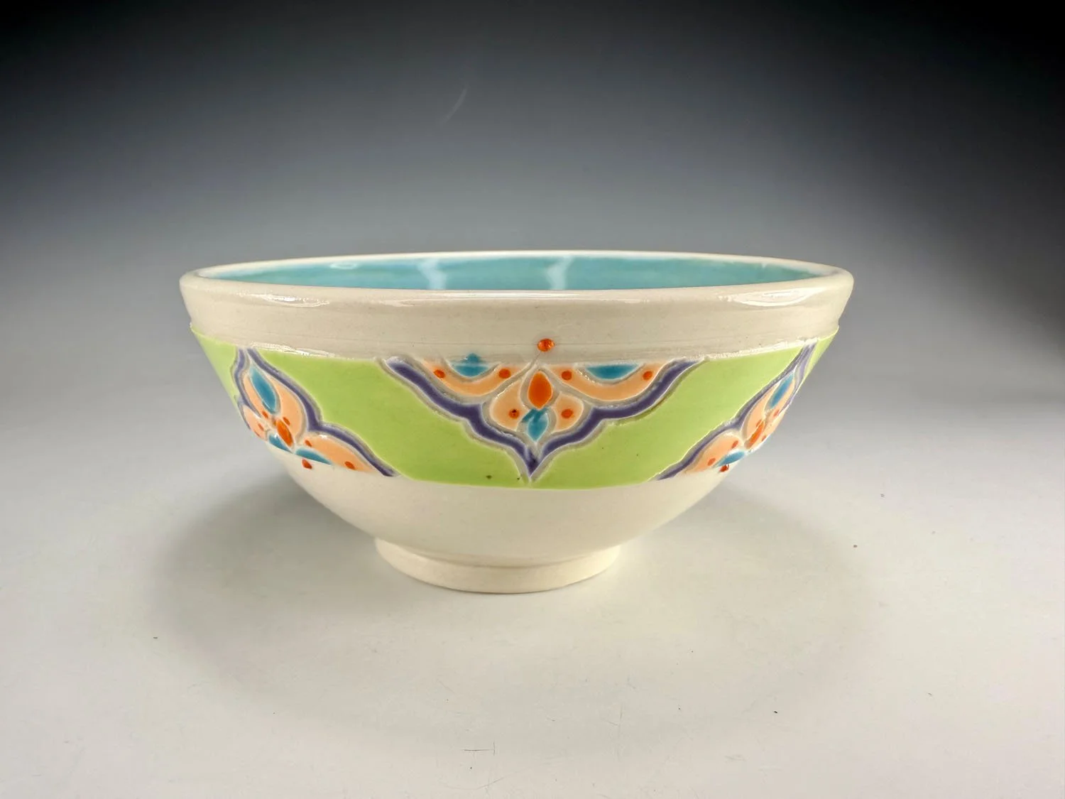 Bowl 2 of Porcelain snack bowl set w blue liner and hand carved outer designs