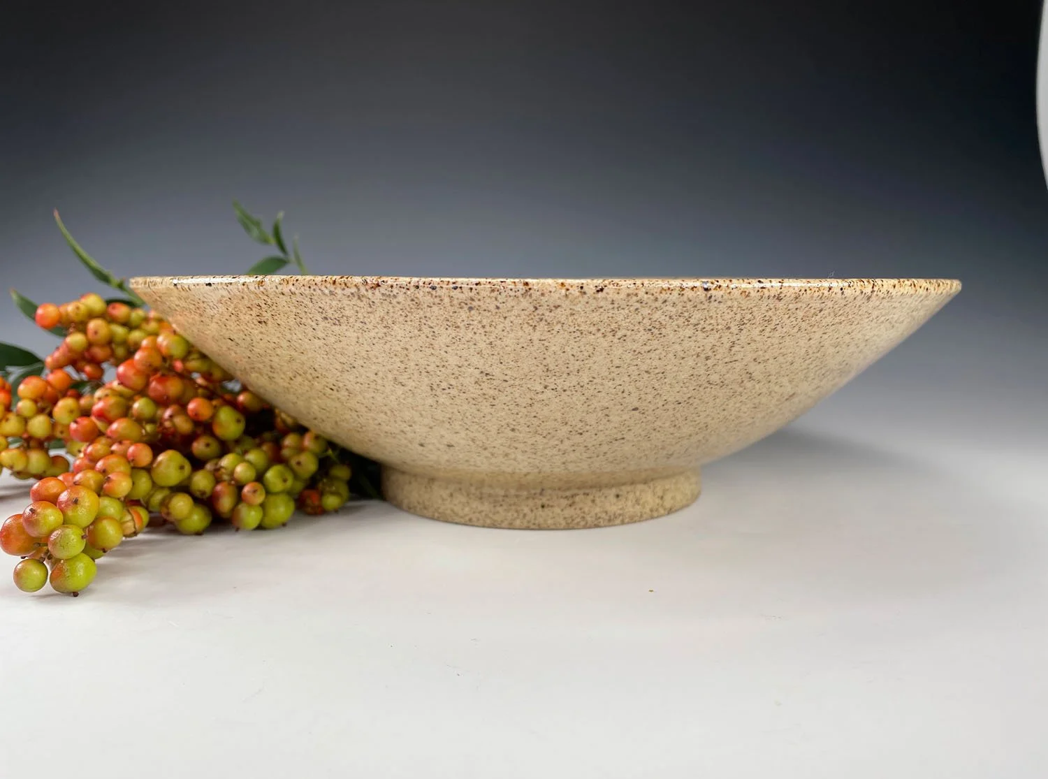 Side view of Multicolored stoneware serving bowl