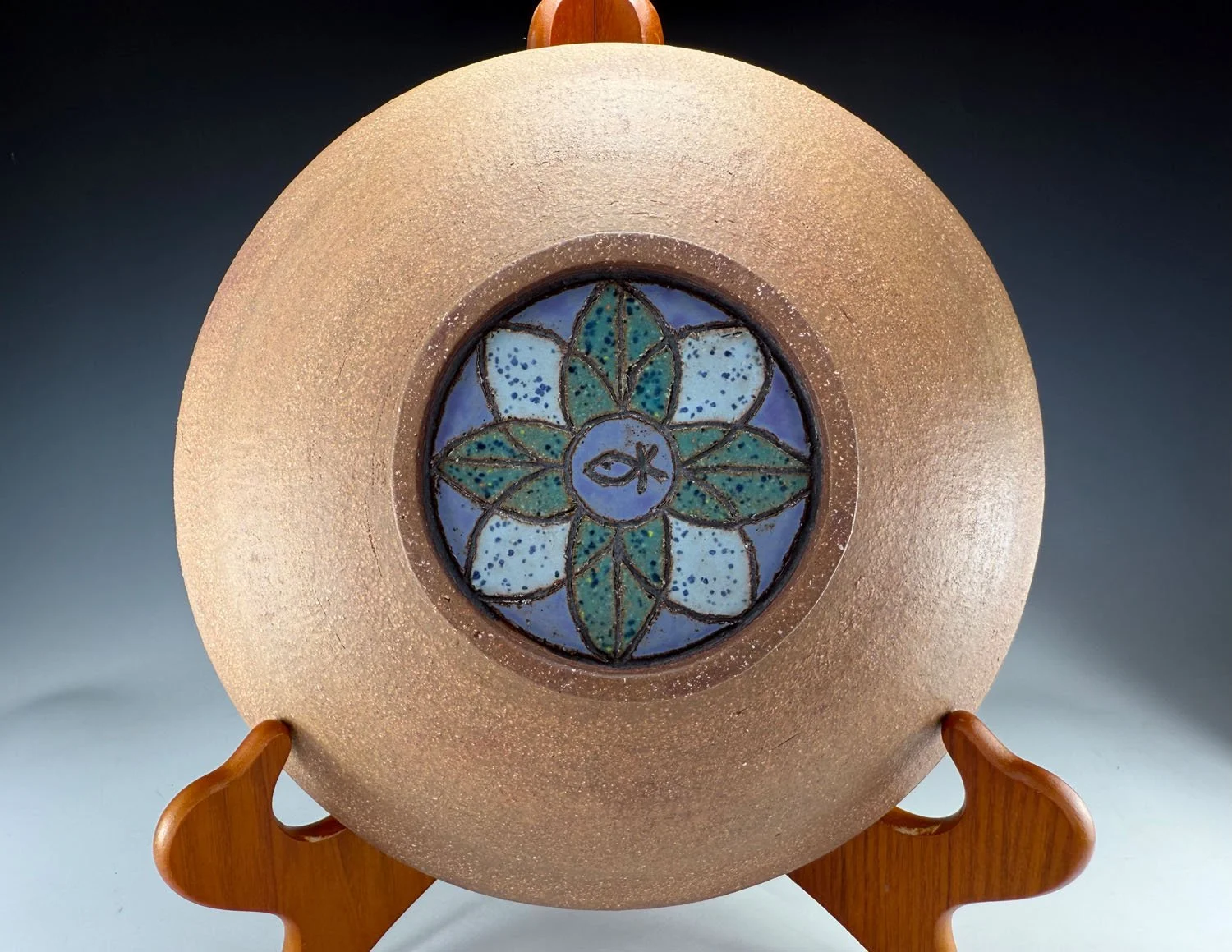 Back of Blue green carved red stoneware serving bowl